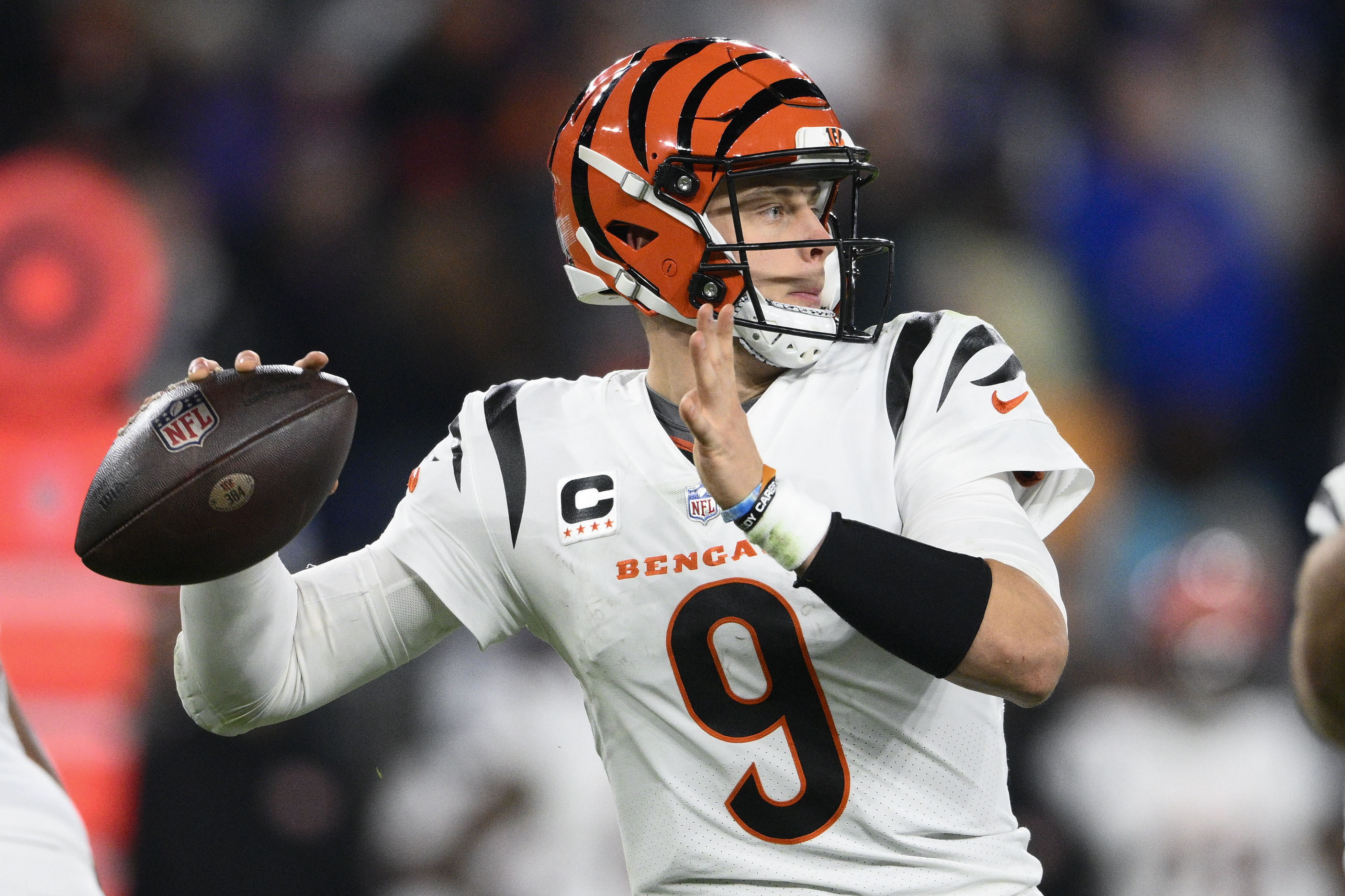 Cincinnati Bengals quarterback Joe Burrow (9) looks to pass in the first half of an NFL football game against the Baltimore Ravens in Baltimore, Thursday, Nov. 16, 2023. 