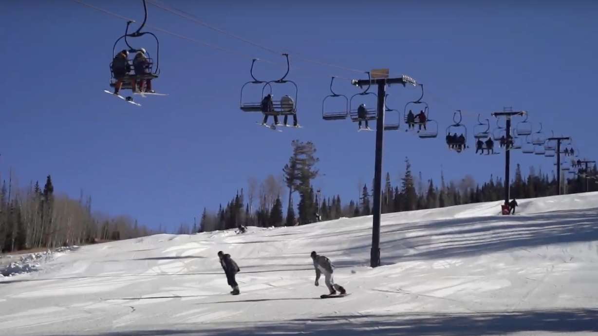 Snowboarders travel down a slope at Brian Head Resort on Friday, the resort's opening day. Brian Head and Utah's other resorts made many changes and upgrades this offseason.