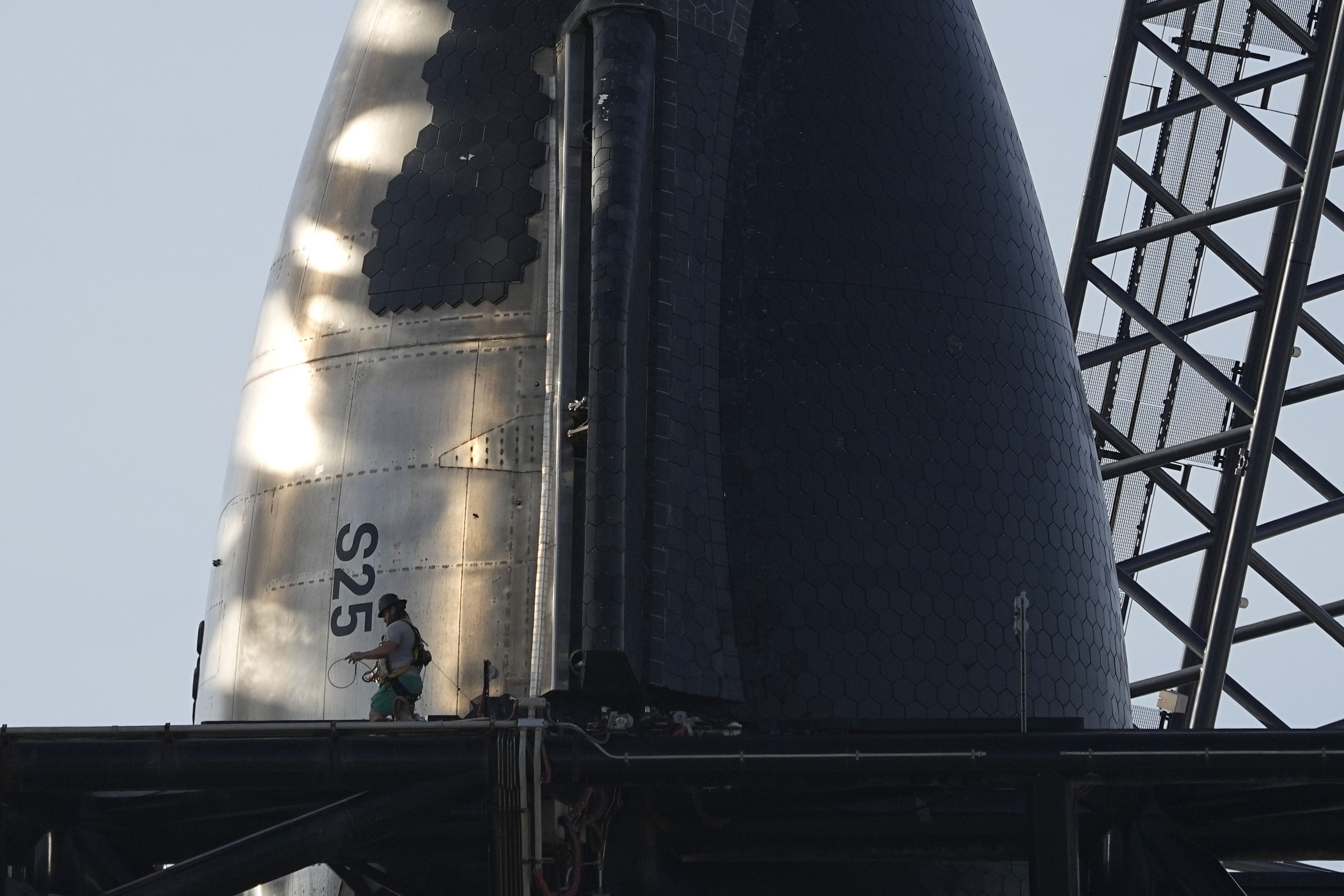 SpaceX’s mega-rocket Starship is prepared for its upcoming launch from Starbase in Boca Chica, Texas, on Thursday. The launch is set for Saturday.
