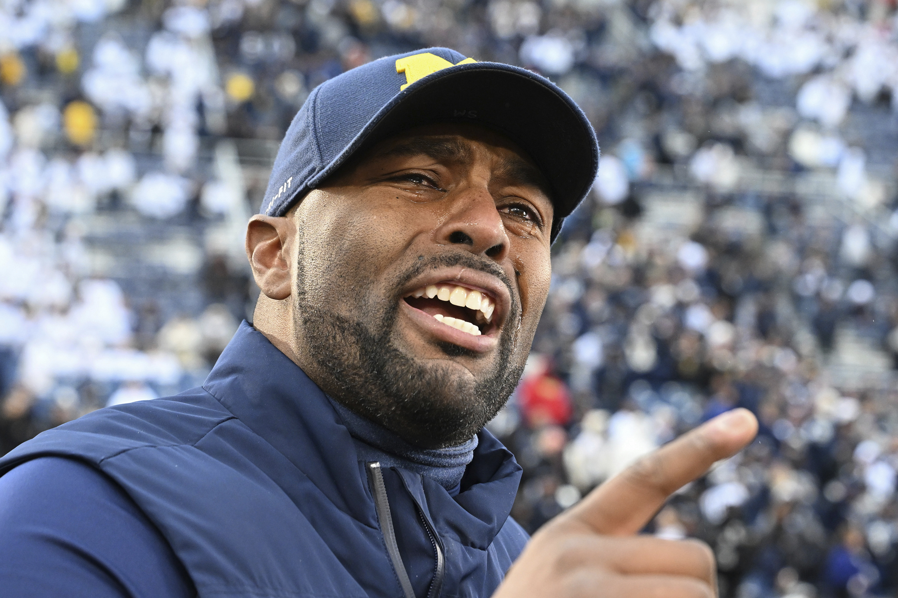 Michigan acting head coach Sherrone Moore celebrates a 24-15 win over Penn State following an NCAA college football game, Saturday, Nov. 11, 2023, in State College, Pa. 