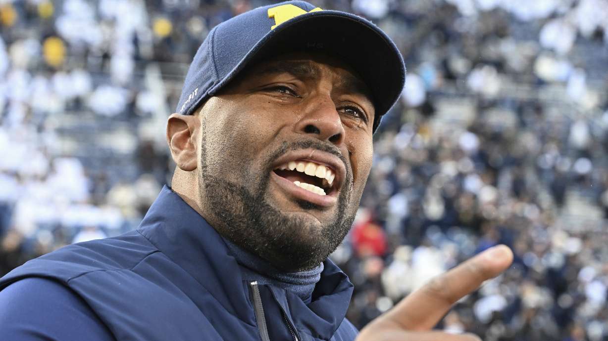 Michigan acting head coach Sherrone Moore celebrates a 24-15 win over Penn State following an NCAA college football game, Saturday, Nov. 11, 2023, in State College, Pa.