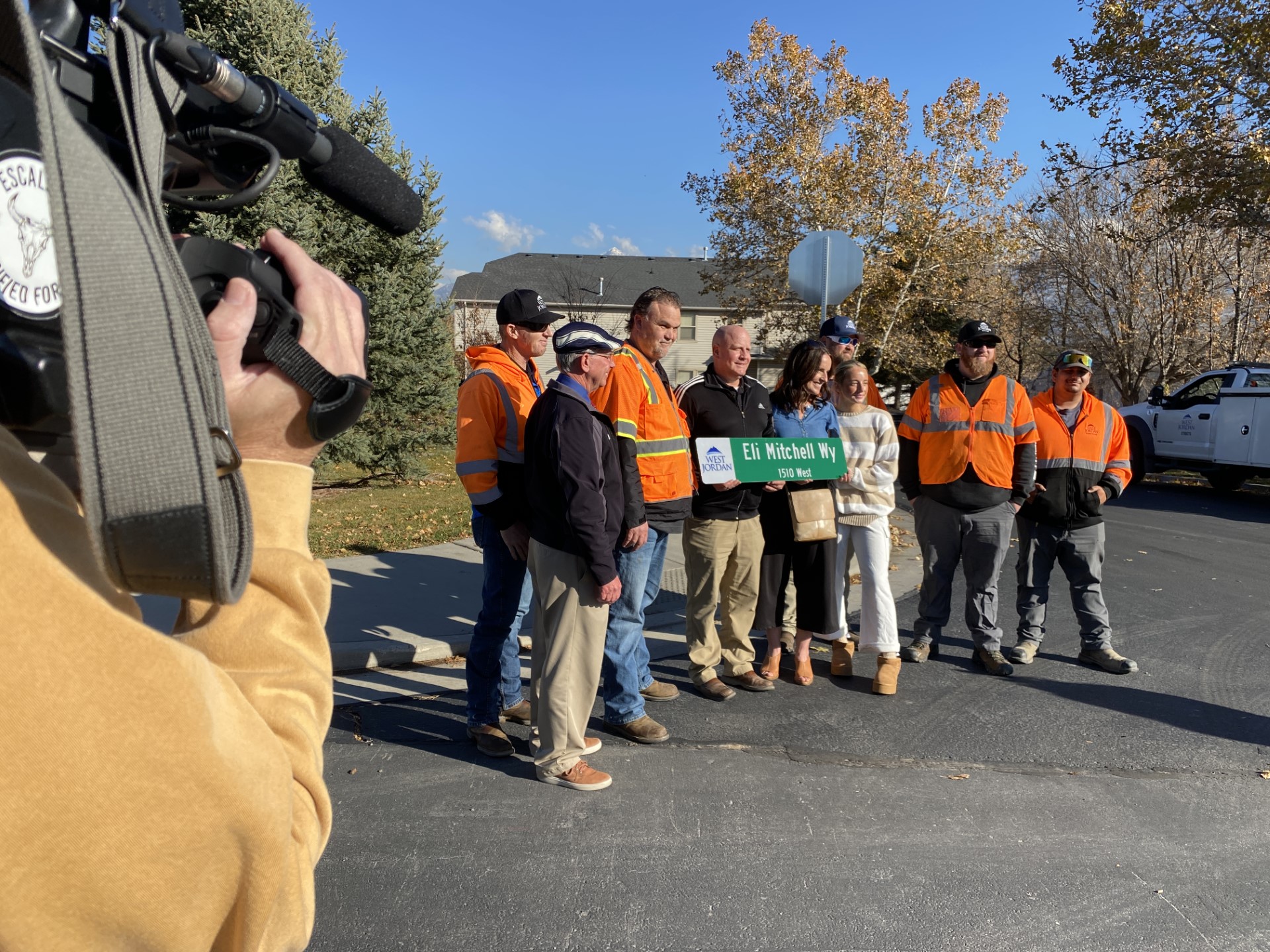 Family members converged on a street corner Friday as city workers installed new signs marking the renaming of a street in memory of a 13-year-old boy killed in a crosswalk by a drunk driver.