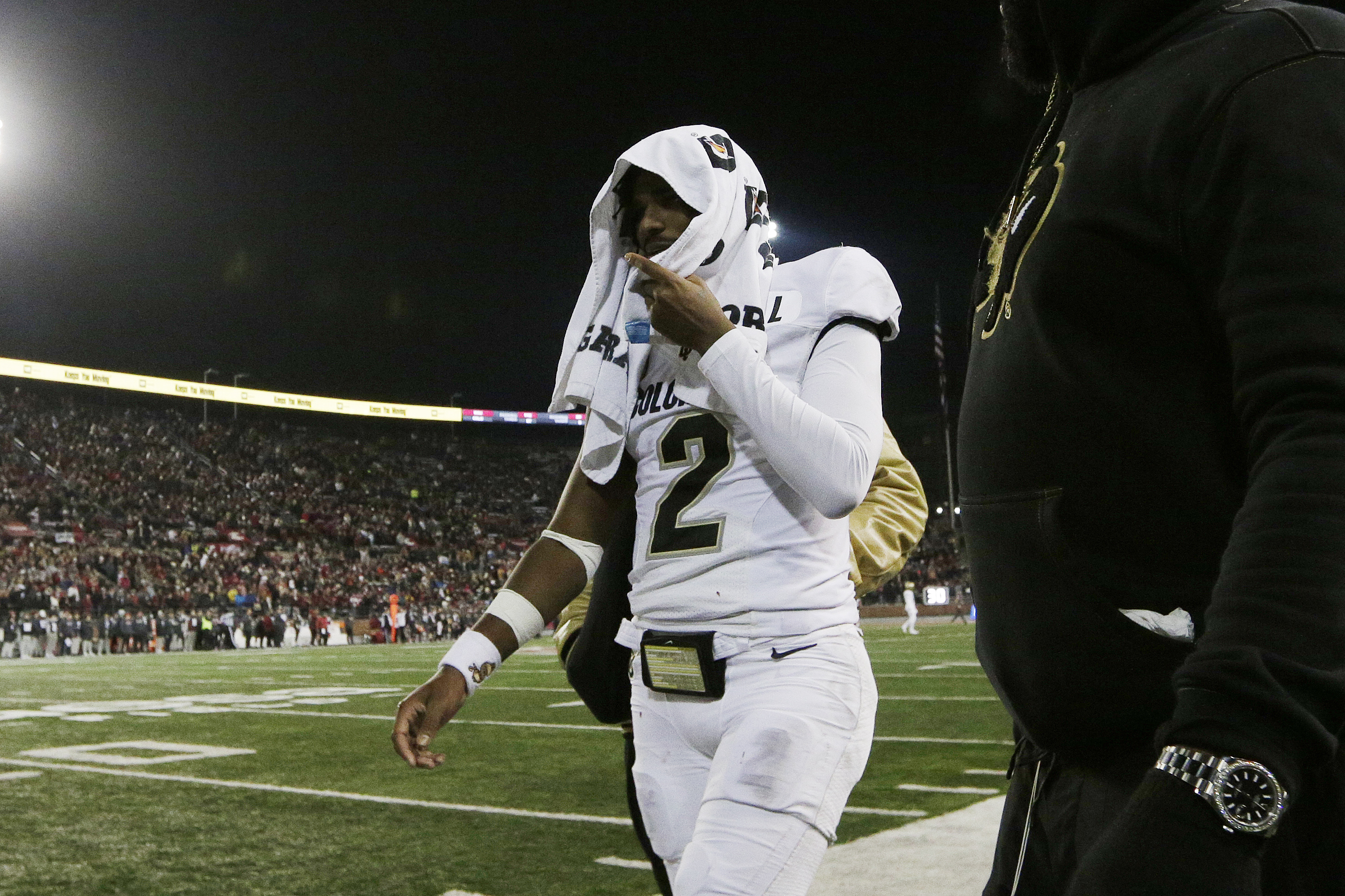 Colorado quarterback Shedeur Sanders (2) walks toward the locker room during the first half of the team's NCAA college football game against Washington State, Friday, Nov. 17, 2023, in Pullman, Wash. 