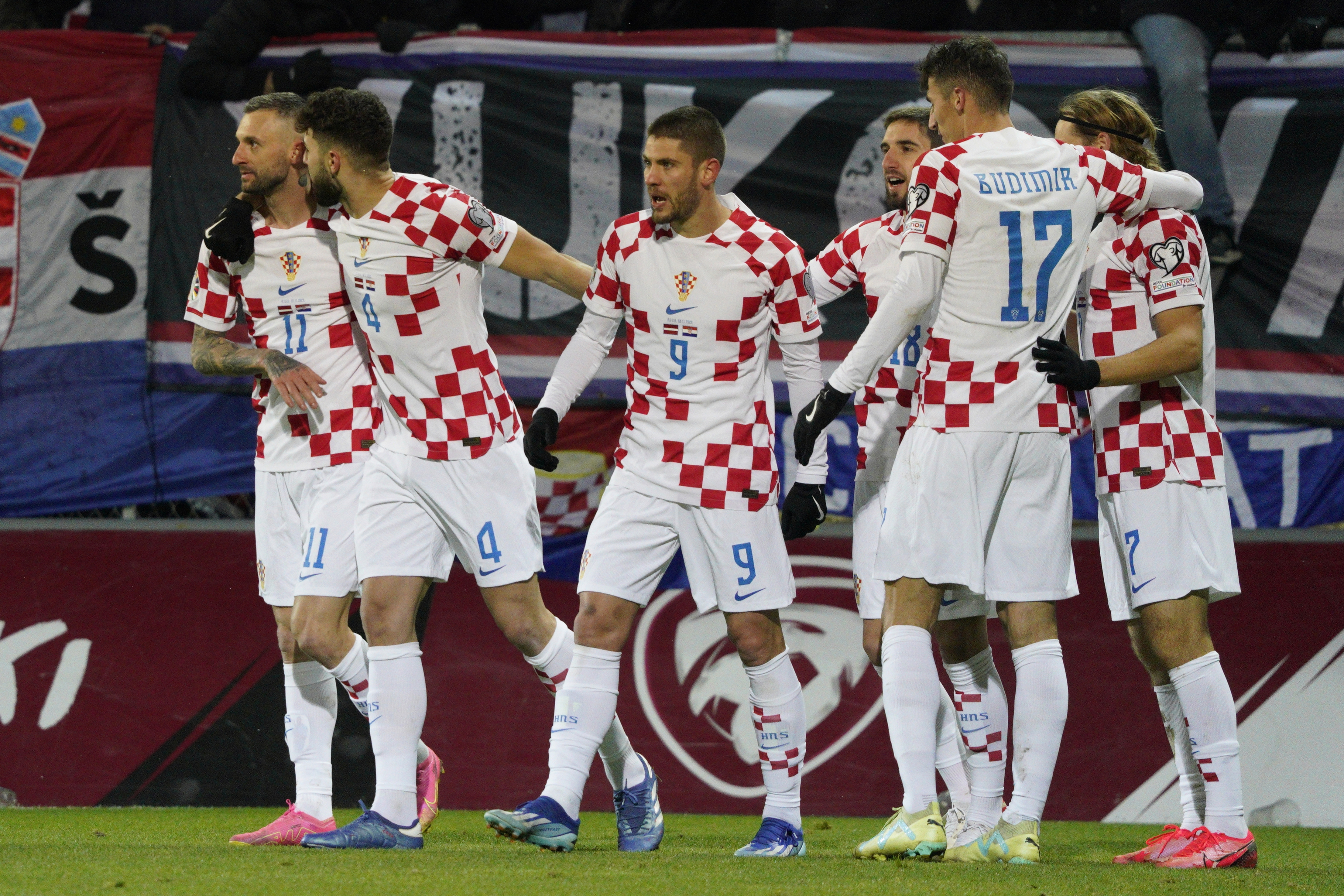 Croatia's Andrej Kramaric, center celebrates with teammates after scoring his side's second goal during the Euro 2024 group D qualifying soccer match between Latvia and Croatia at Skonto stadium in Riga, Latvia, Saturday, Nov. 18, 2023. 
