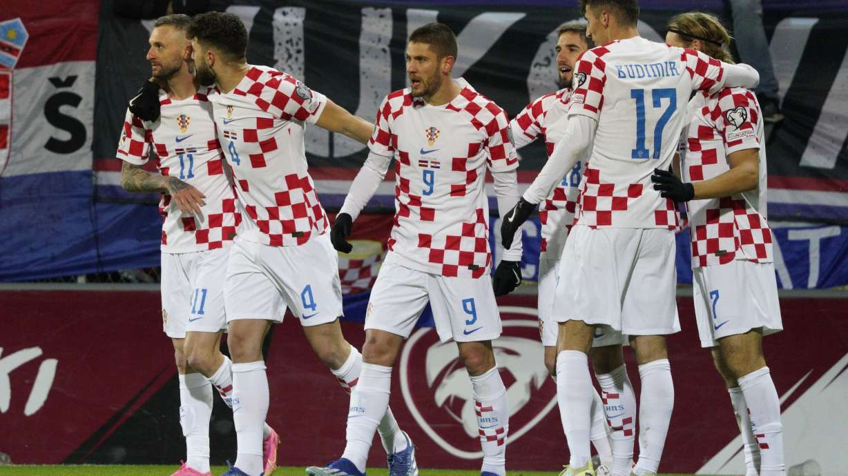 Croatia's Andrej Kramaric, center celebrates with teammates after scoring his side's second goal during the Euro 2024 group D qualifying soccer match between Latvia and Croatia at Skonto stadium in Riga, Latvia, Saturday, Nov. 18, 2023.