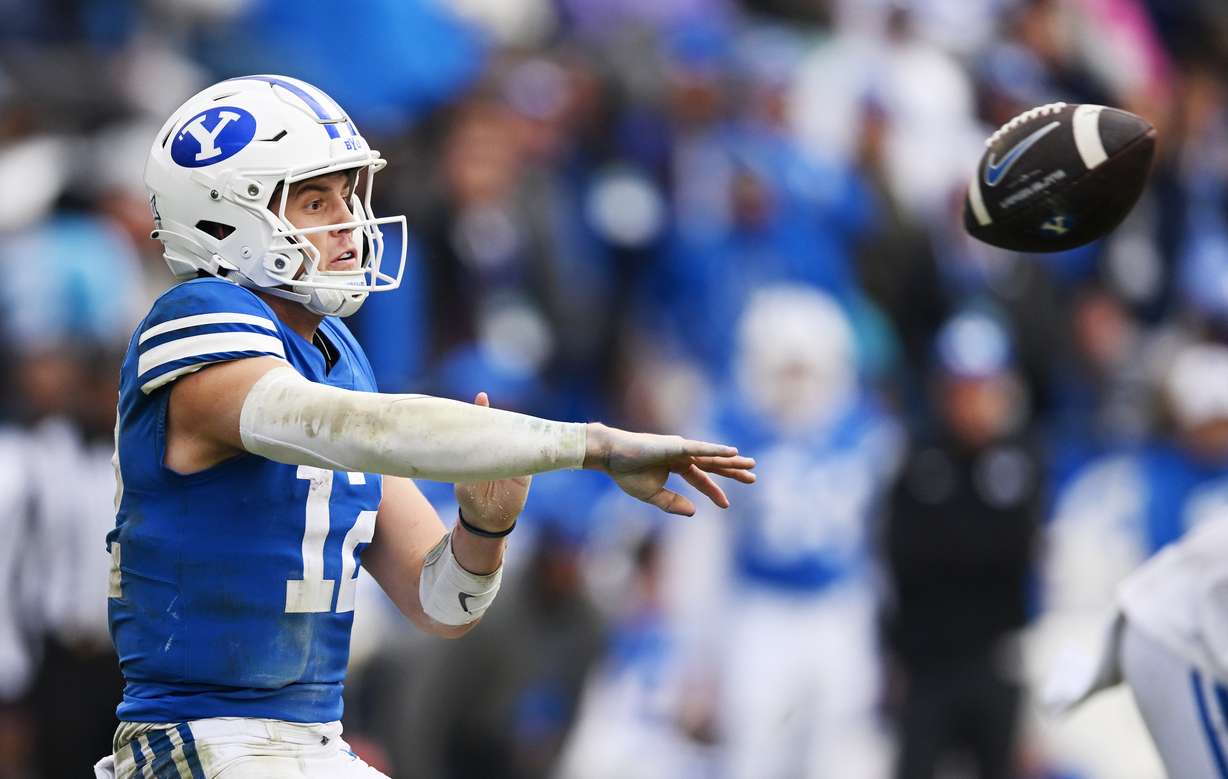 Brigham Young quarterback Jake Retzlaff (12) passes the ball as BYU and Oklahoma play at LaVell Edwards stadium in Provo on Saturday, Nov. 18, 2023. OU won 31-24.