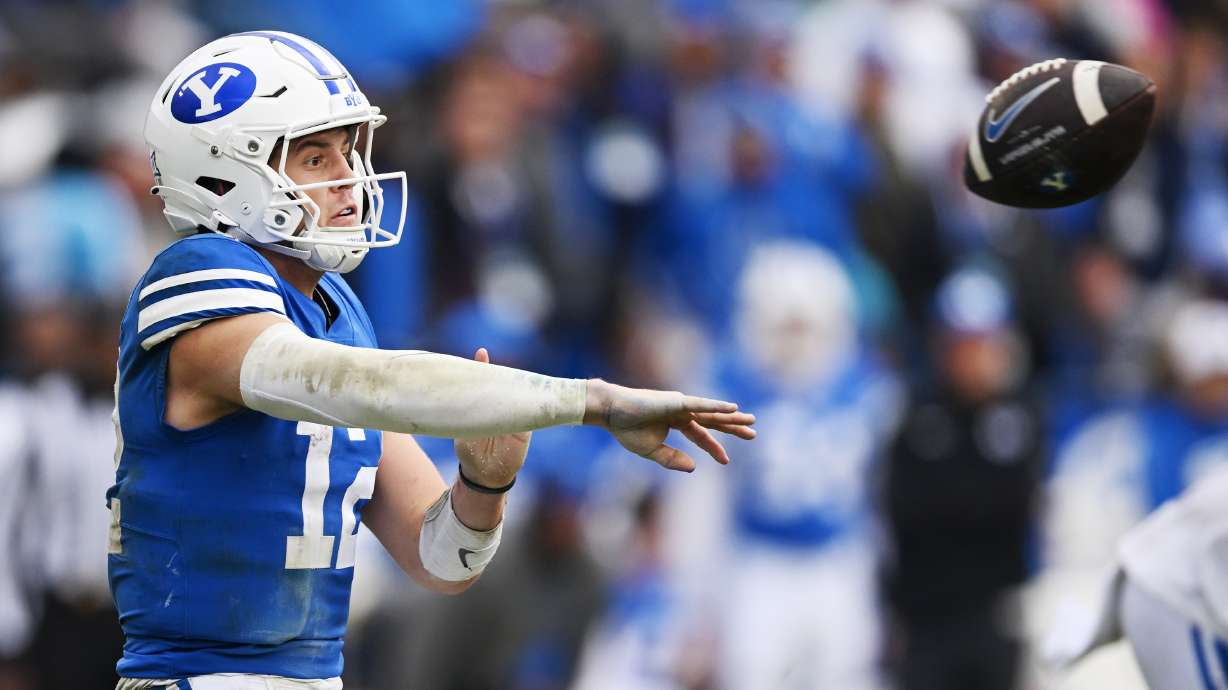 Brigham Young quarterback Jake Retzlaff (12) passes the ball as BYU and Oklahoma play at LaVell Edwards stadium in Provo on Saturday, Nov. 18, 2023. OU won 31-24.