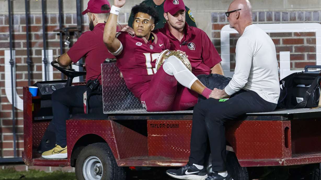 Florida State quarterback Jordan Travis is taken off the field after being injured during the first half of the team's NCAA college football game against North Alabama, Saturday, Nov. 18, 2023, in Tallahassee, Fla.