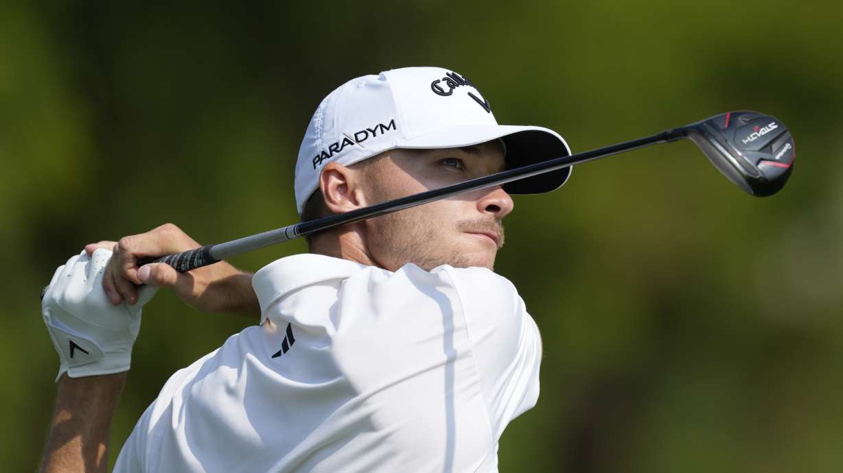 Nicolai Hojgaard of Denmark plays his second shot on the second hole hole during the final round of the DP World Tour Championship golf tournament, in Dubai, United Arab Emirates, Sunday, Nov. 19, 2023.