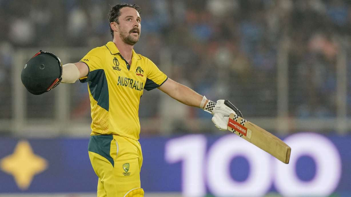 Australia's Travis Head celebrates after scoring a century during the ICC Men's Cricket World Cup final match between Australia and India in Ahmedabad, India, Sunday, Nov.19, 2023.