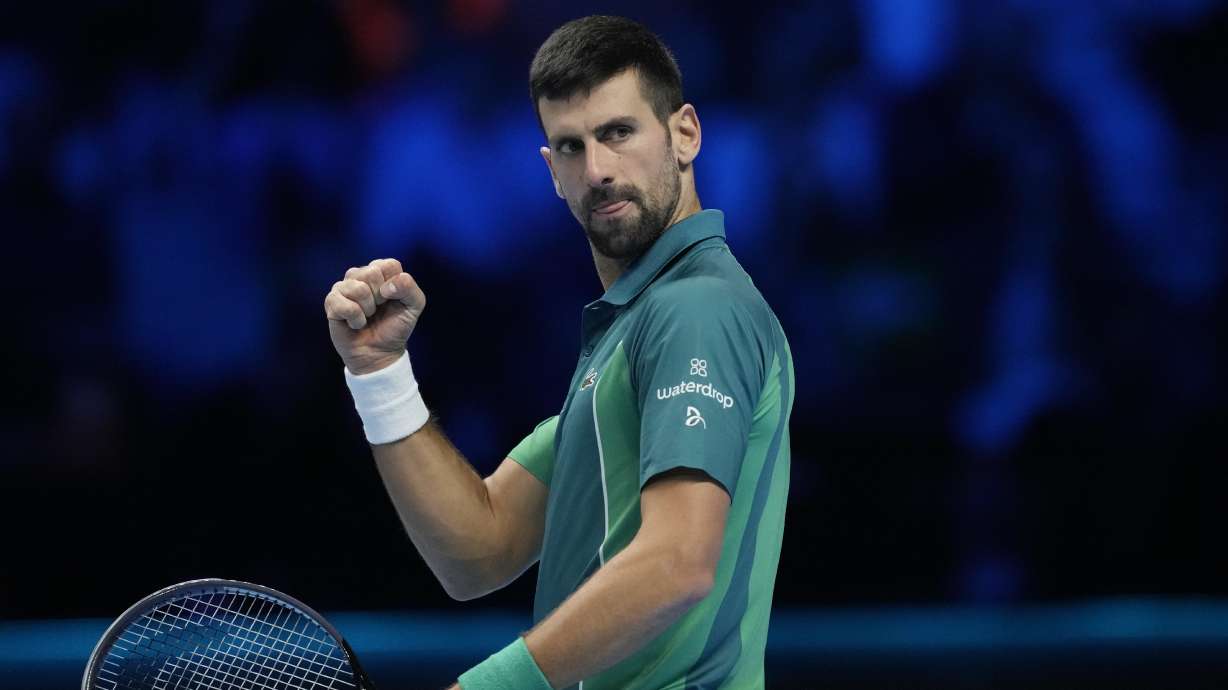 Serbia's Novak Djokovic reacts after winning a point to Italy's Jannik Sinner during their singles final tennis match of the ATP World Tour Finals at the Pala Alpitour, in Turin, Italy, Sunday, Nov. 19, 2023.