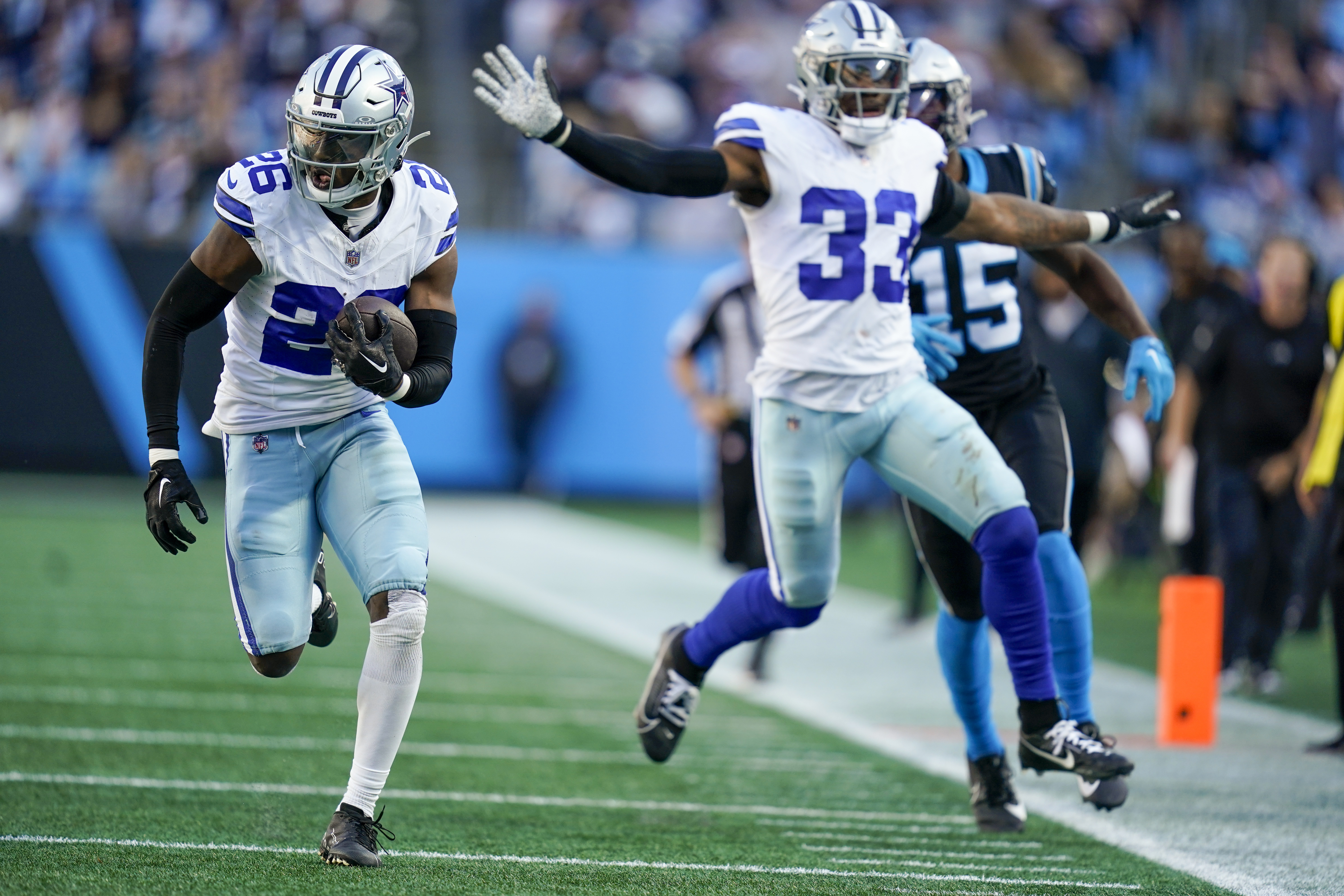 Dallas Cowboys cornerback DaRon Bland runs for a touchdown after intercepting the pass against the Carolina Panthers during the second half of an NFL football game Sunday, Nov. 19, 2023, in Charlotte, N.C.