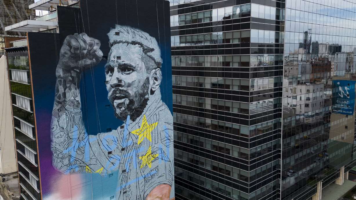 A mural depicting soccer legend Lionel Messi, by artist Martin Ron, adorns a building on the 9 de Julio avenue in Buenos Aires, Argentina, Saturday, Nov. 18, 2023.