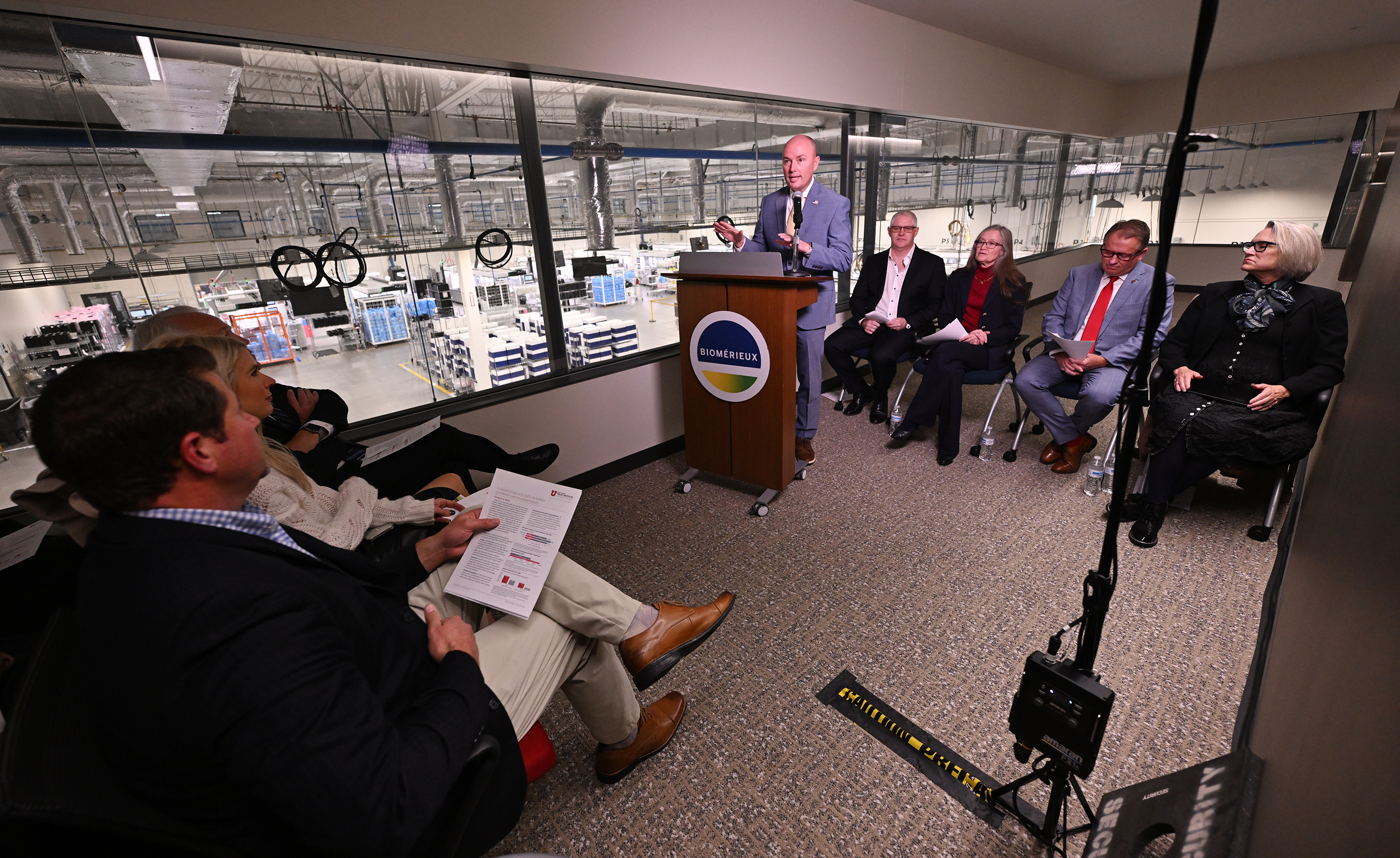 Gov. Spencer J. Cox speaks at bioMérieux in Salt Lake City, with General Manager and Head of Clinical Operations Colin Hill, Sen. Ann Millner, R-Ogden, University of Utah President Taylor Randall and Utah State University President Elizabeth Cantwell. Cox announced a proposal aimed at supporting Utah’s life sciences workforce on Monday.