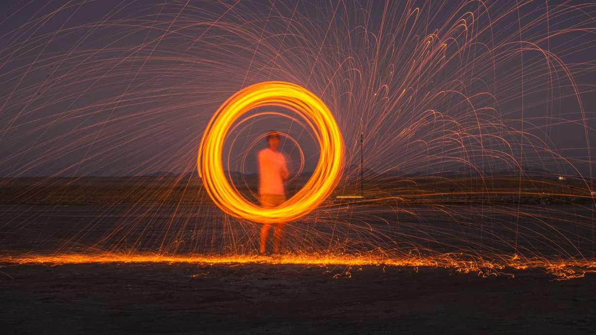 Britton and Sarandon Rasmussen, of Kaysville, keep the spark alive in their relationship by finding new and different ways to reinvent date night, like pairing fire with long-exposure photography.