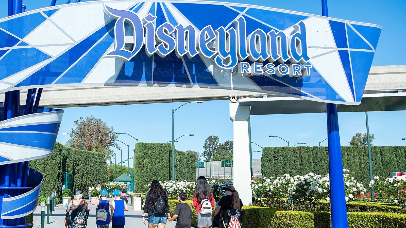Visitors enter Disneyland in Anaheim, Calif., in 2021. One person was transported to a local hospital with “serious injuries” and two others were injured after a light pole fell at Disneyland on Monday.