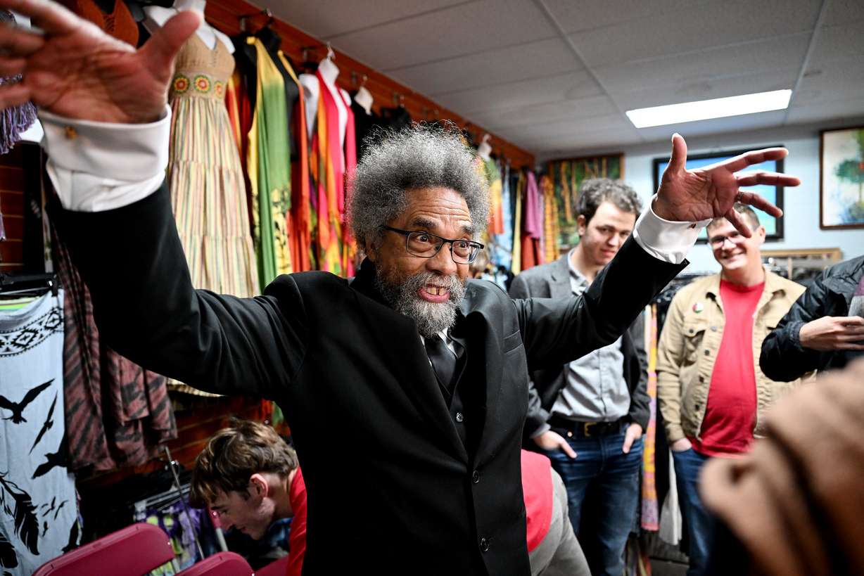 Presidential candidate Cornel West talks with a small group of supporters while at Twisted Roots in Salt Lake City on Monday.