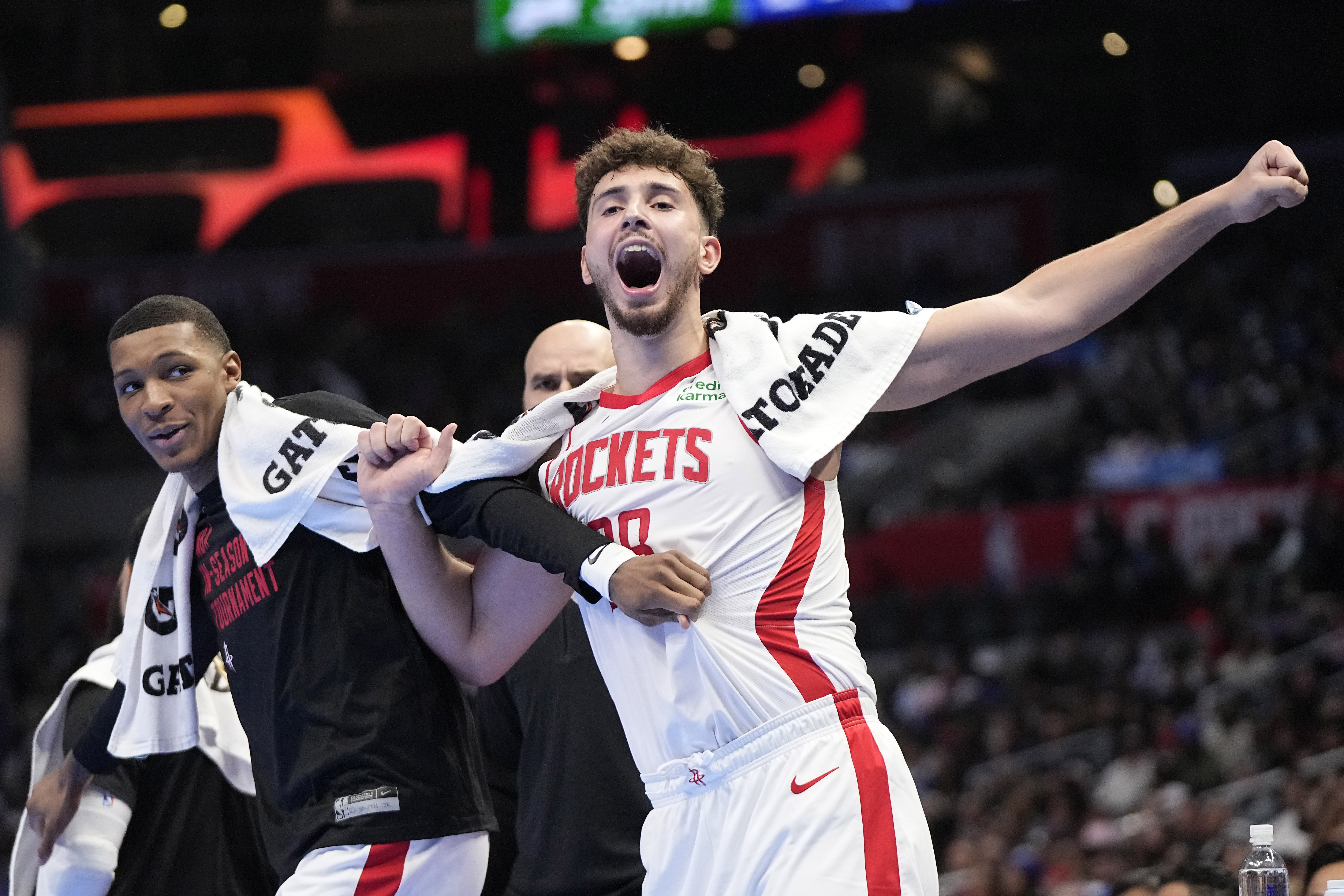 Houston Rockets forward Jabari Smith Jr., left, and center Alperen Sengun celebrate from the bench after they the Rockets scored during the second half of an NBA basketball In-Season Tournament game against the Los Angeles Clippers Friday, Nov. 17, 2023, in Los Angeles. 