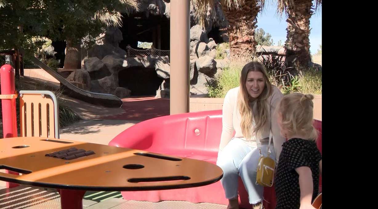 Hannah MacDonald plays with her daughter in St. George. The majority of Americans, especially women, feel overwhelmed by group texts.