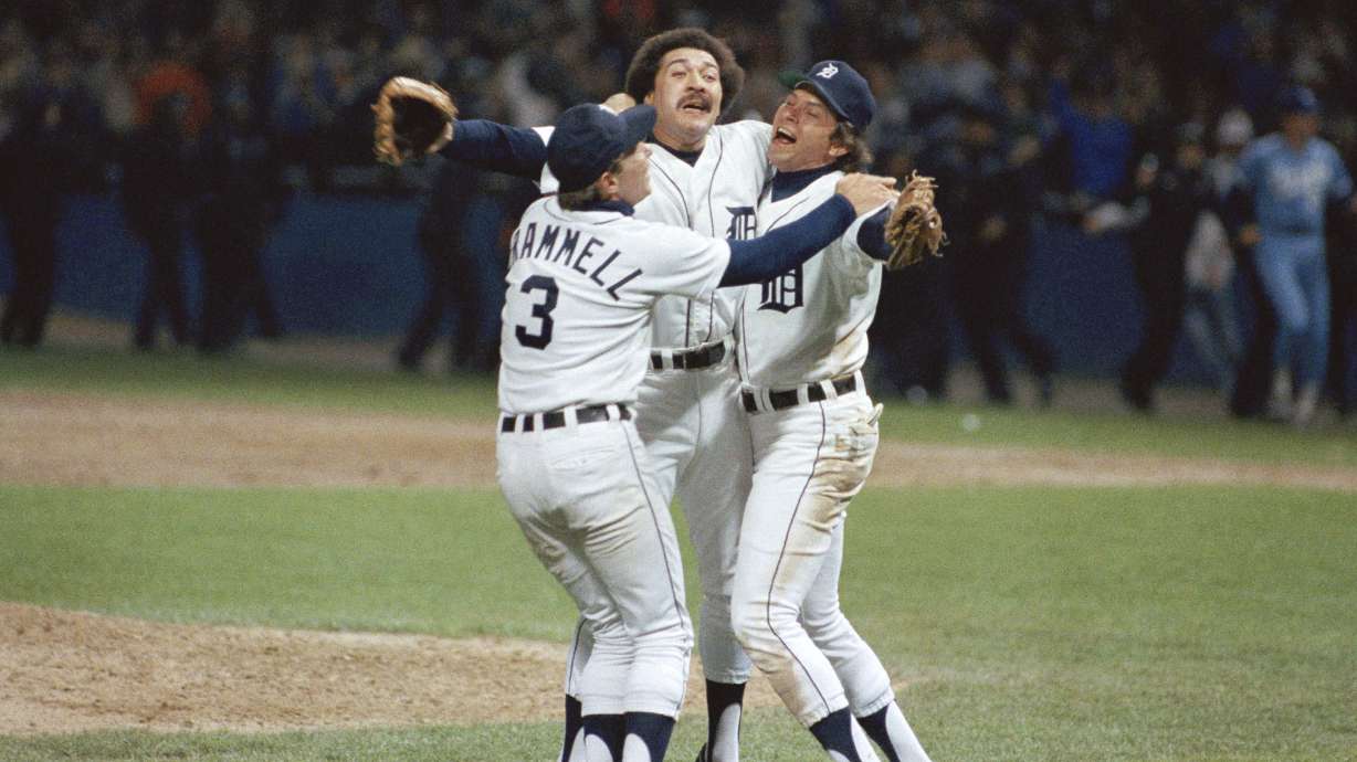 FILE - Detroit's Alan Trammell, left, Willie Hernandez and Darrell Evans, right, celebrate after they beat the Kansas City Royals 1-0 to win the American League Championship in Detroit, Oct. 5, 1984. Three-time All-Star relief pitcher Hernández, who won the 1984 Cy Young and Most Valuable Player awards as part of the World Series champion Detroit Tigers, has died. He was 69.