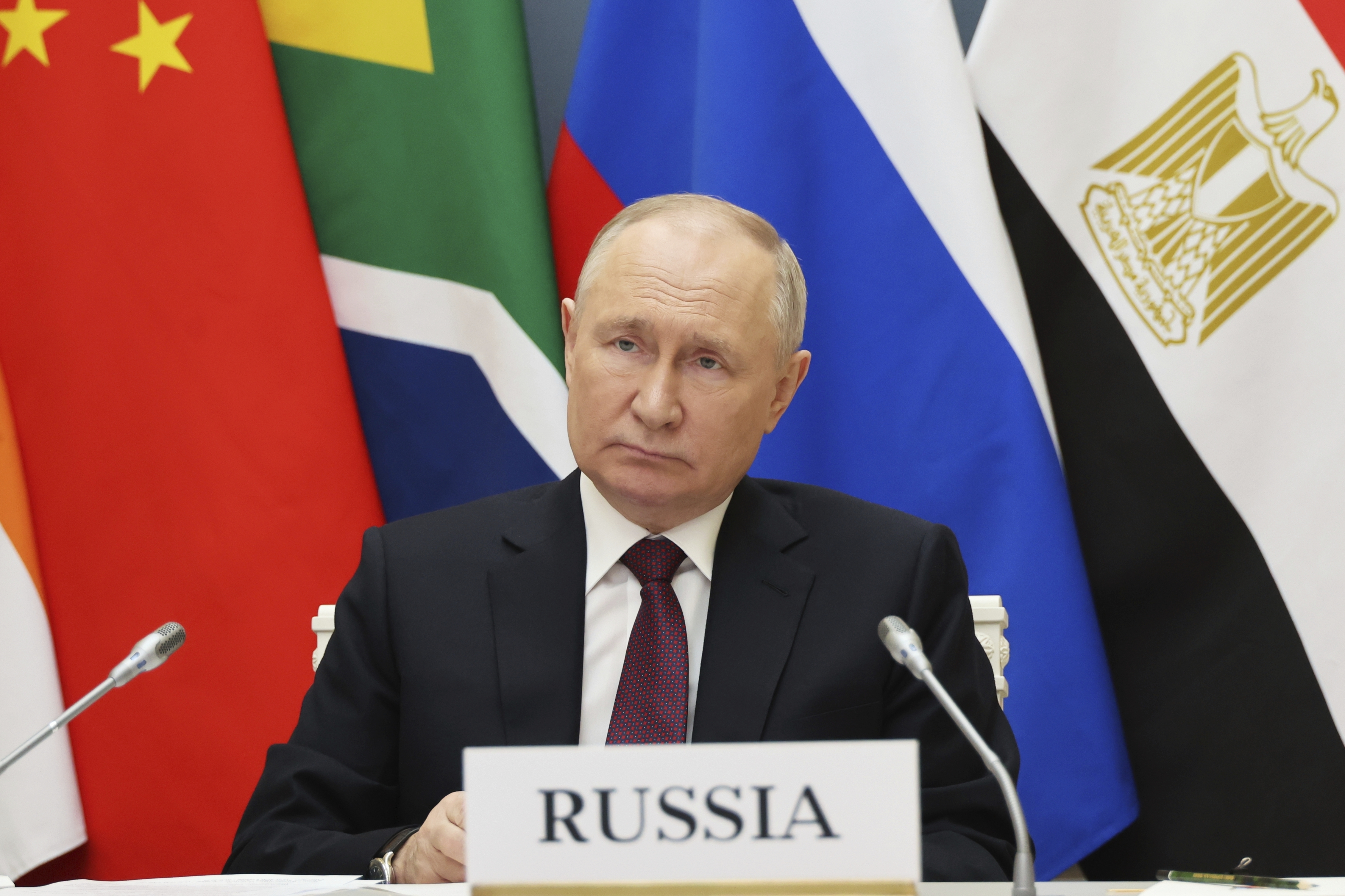 Russian President Vladimir Putin takes part in an extraordinary BRICS summit to discuss the Palestinian-Israeli conflict via videoconference at the Kremlin in Moscow, Russia, Tuesday, Nov. 21, 2023.