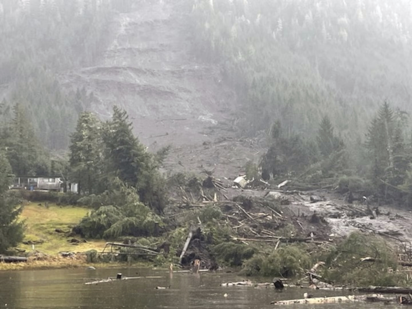 In this image provided by the U.S. Coast Guard is the aftermath of a landslide in Wrangell, Alaska, on Tuesday. Three people died, officials said.