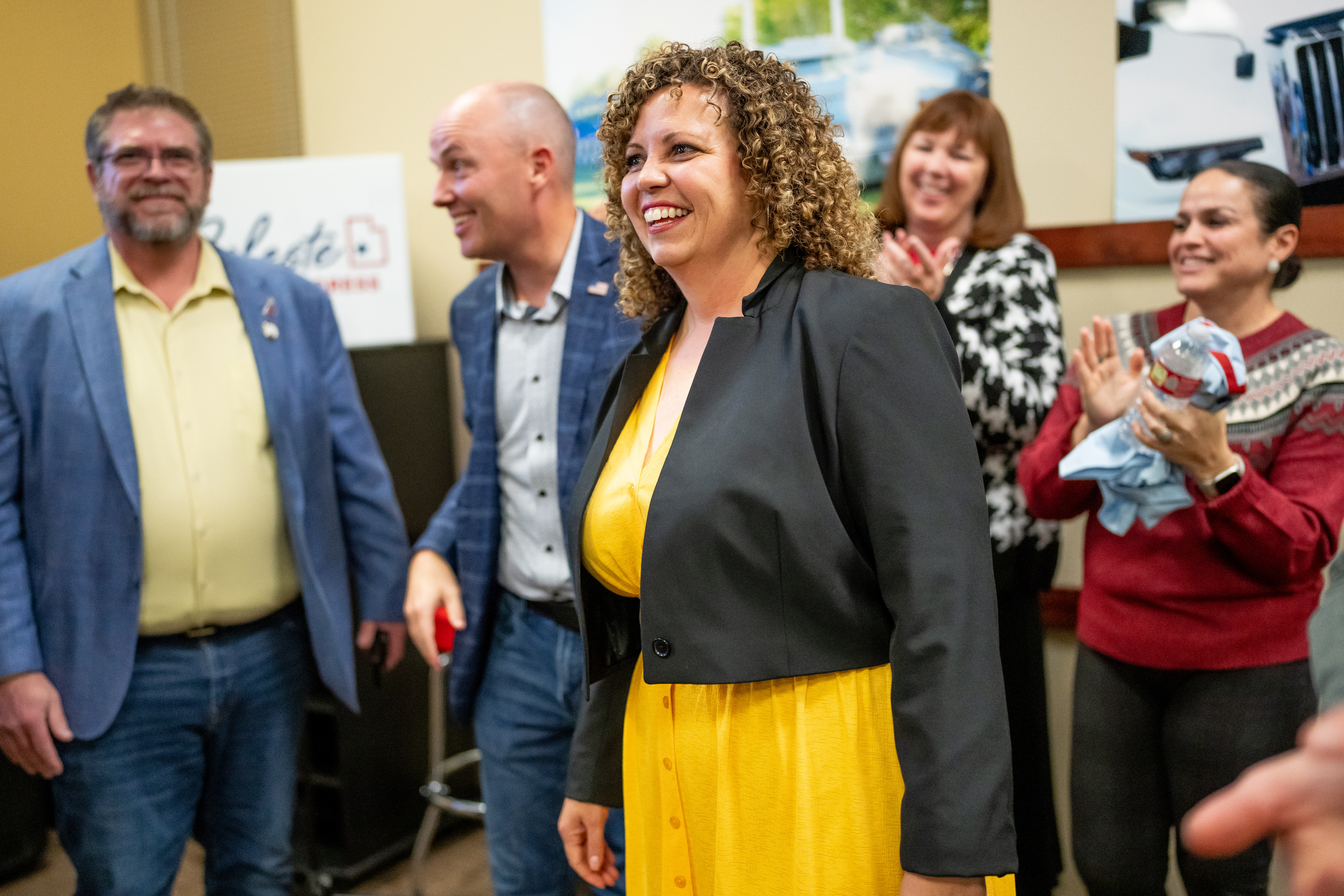 Celeste Maloy reacts after the election was called in her favor, with Gov. Spencer Cox, second from left, supporting her at the Utah Trucking Association in West Valley City on Tuesday.