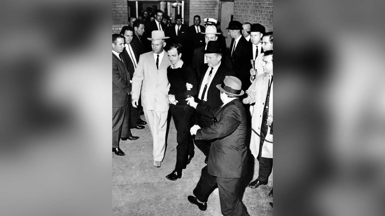 President John F. Kennedy assassin Lee Harvey Oswald, center in handcuffs, was shot by Jack Ruby, foreground, in the underground garage of the Dallas police headquarters on Nov. 24, 1963.