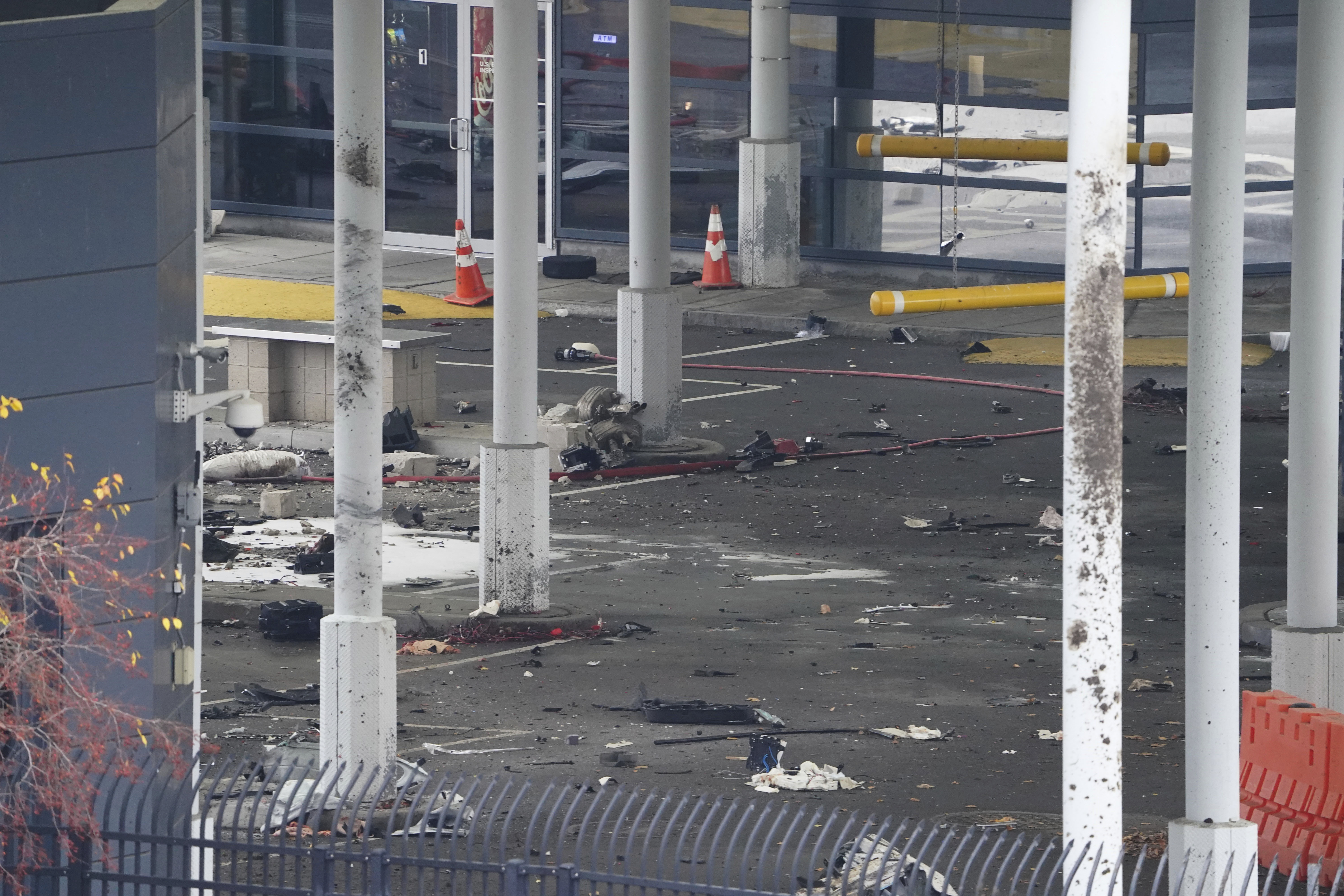Debris is scattered about inside the customs plaza at the Rainbow Bridge border crossing, Wednesday, in Niagara Falls, N.Y. The border crossing between the U.S. and Canada has been closed after a vehicle exploded at a checkpoint on a bridge near Niagara Falls. 