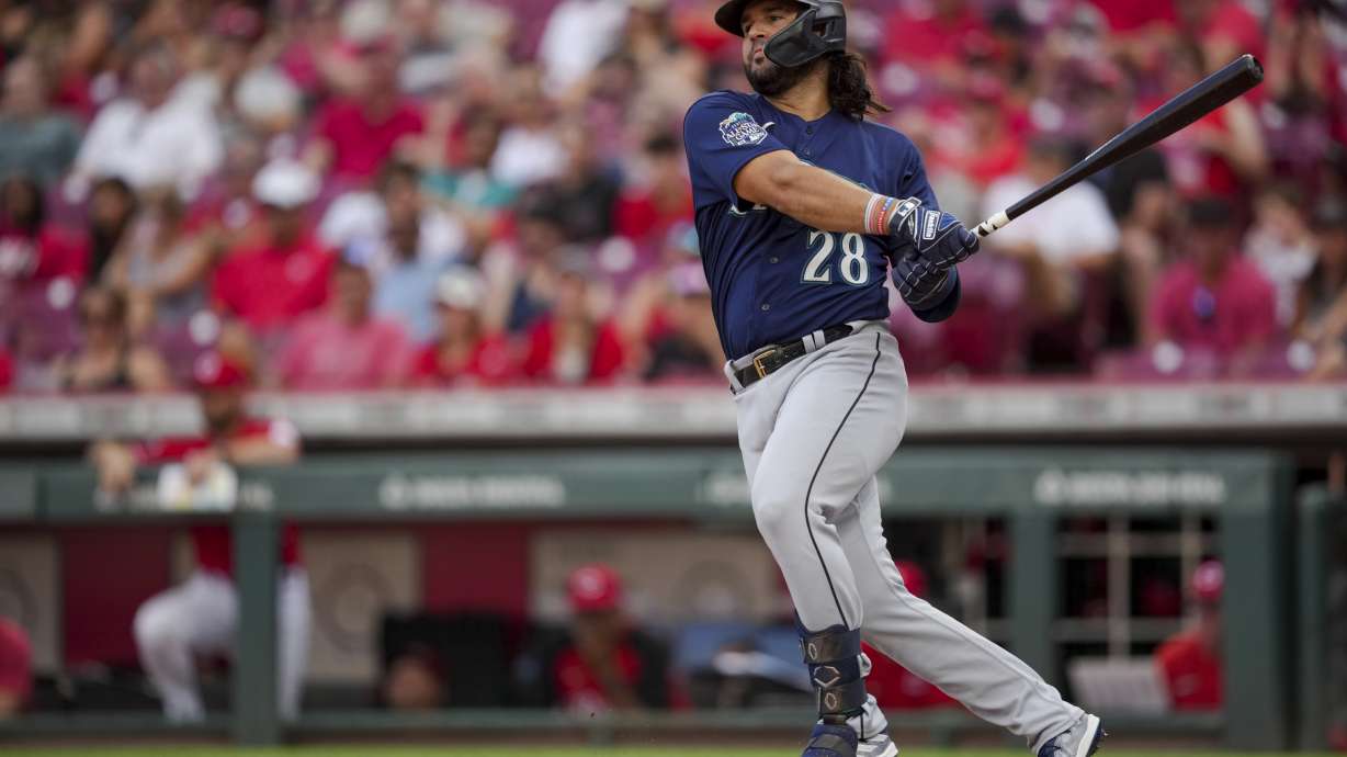 FILE - Seattle Mariners' Eugenio Suarez bats during a baseball game against the Cincinnati Reds in Cincinnati, Monday, Sept. 4, 2023. The Arizona Diamondbacks acquired slugger Eugenio Suárez on Wednesday, Nov. 22, from Mariners for reliever Carlos Vargas and catcher Seby Zavala.