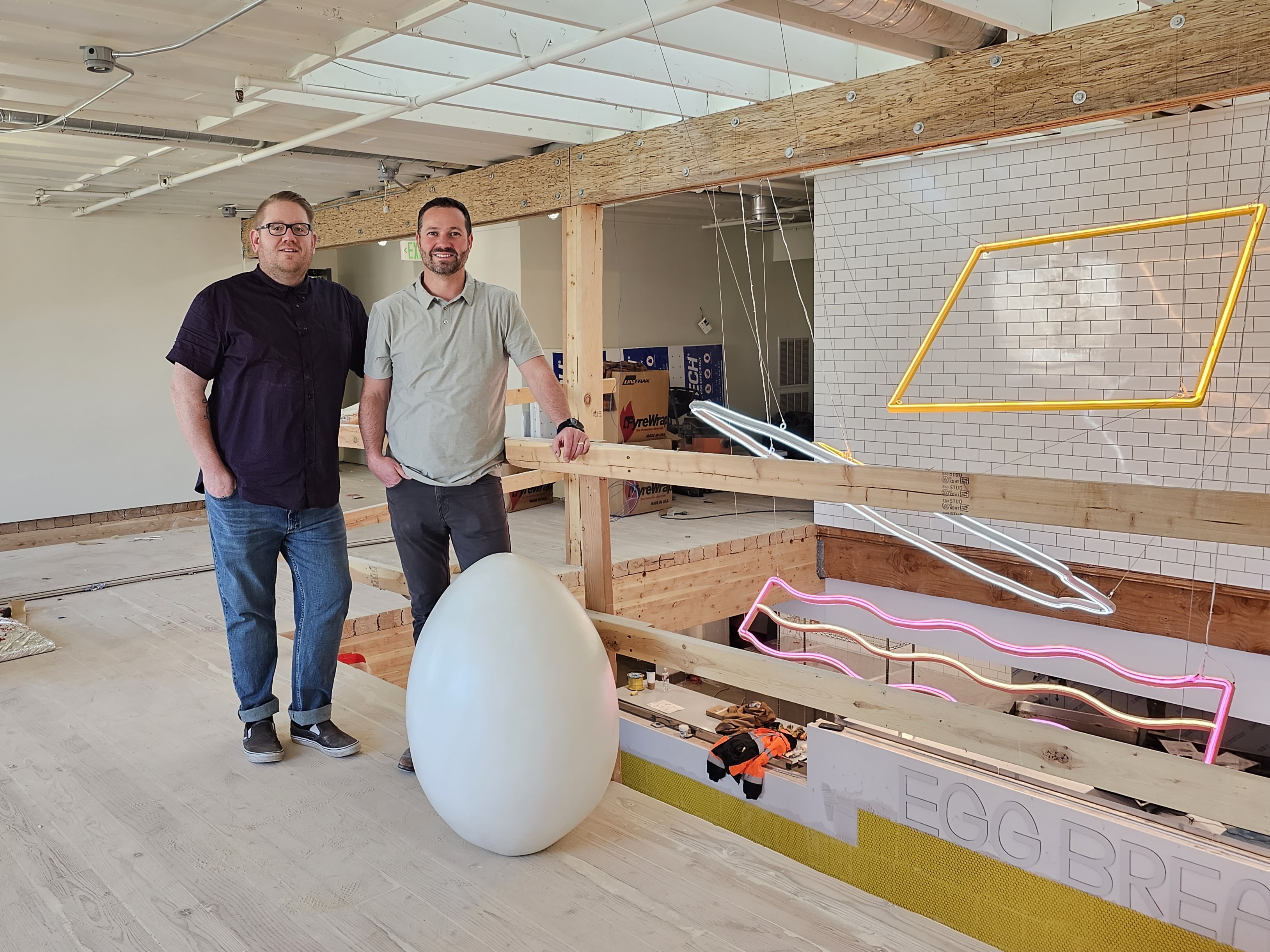 Chad Rigby, executive chef of Egg Break, left, and Clay Beck, its founder, right, pose for a photo inside the new South Salt Lake restaurant. The breakfast sandwich shop is set to hold its grand opening on Dec. 1.