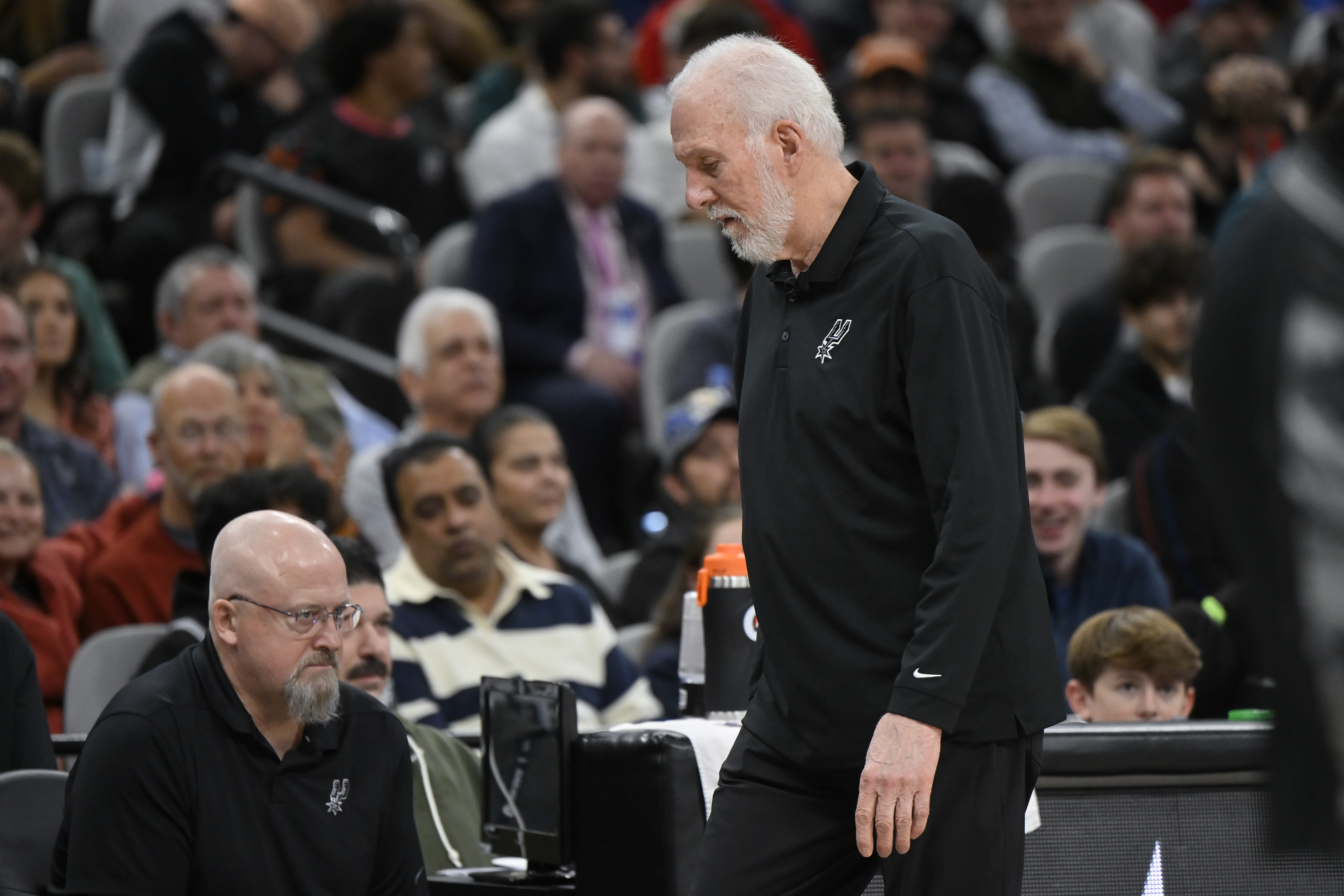 San Antonio Spurs coach Gregg Popovich walks to the bench after addressing fans during the first half of the team's NBA basketball game against the Los Angeles Clippers, Wednesday, Nov. 22, 2023, in San Antonio.