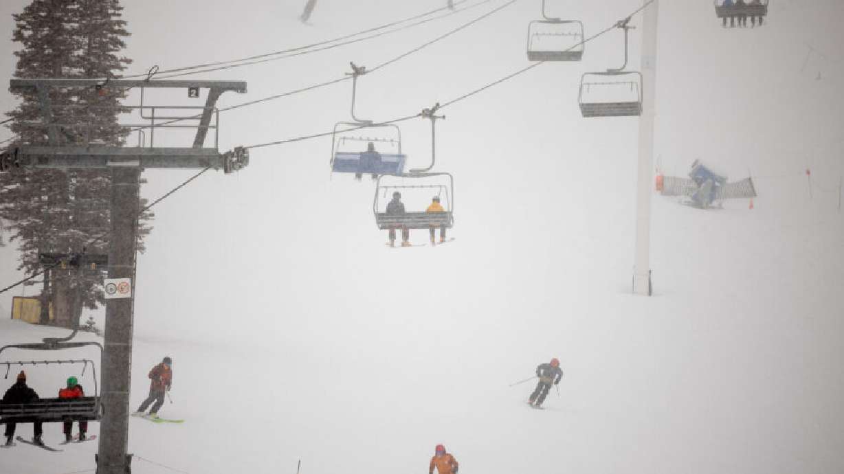 Fresh snow falls on skiers at Alta Ski Area on Dec. 9, 2021. Alta Ski Area announced that its lifts will begin spinning on Saturday.