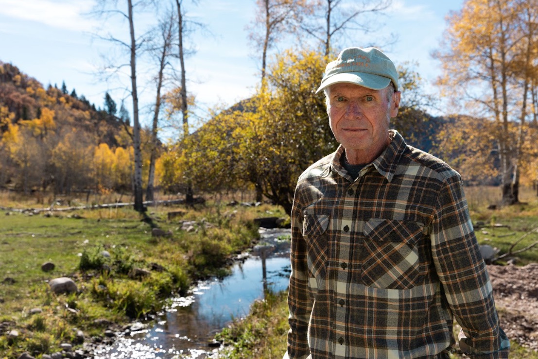Steve Clyde stands by a flume, a humanmade channel for water, at his ranch in Kamas on Oct. 15.