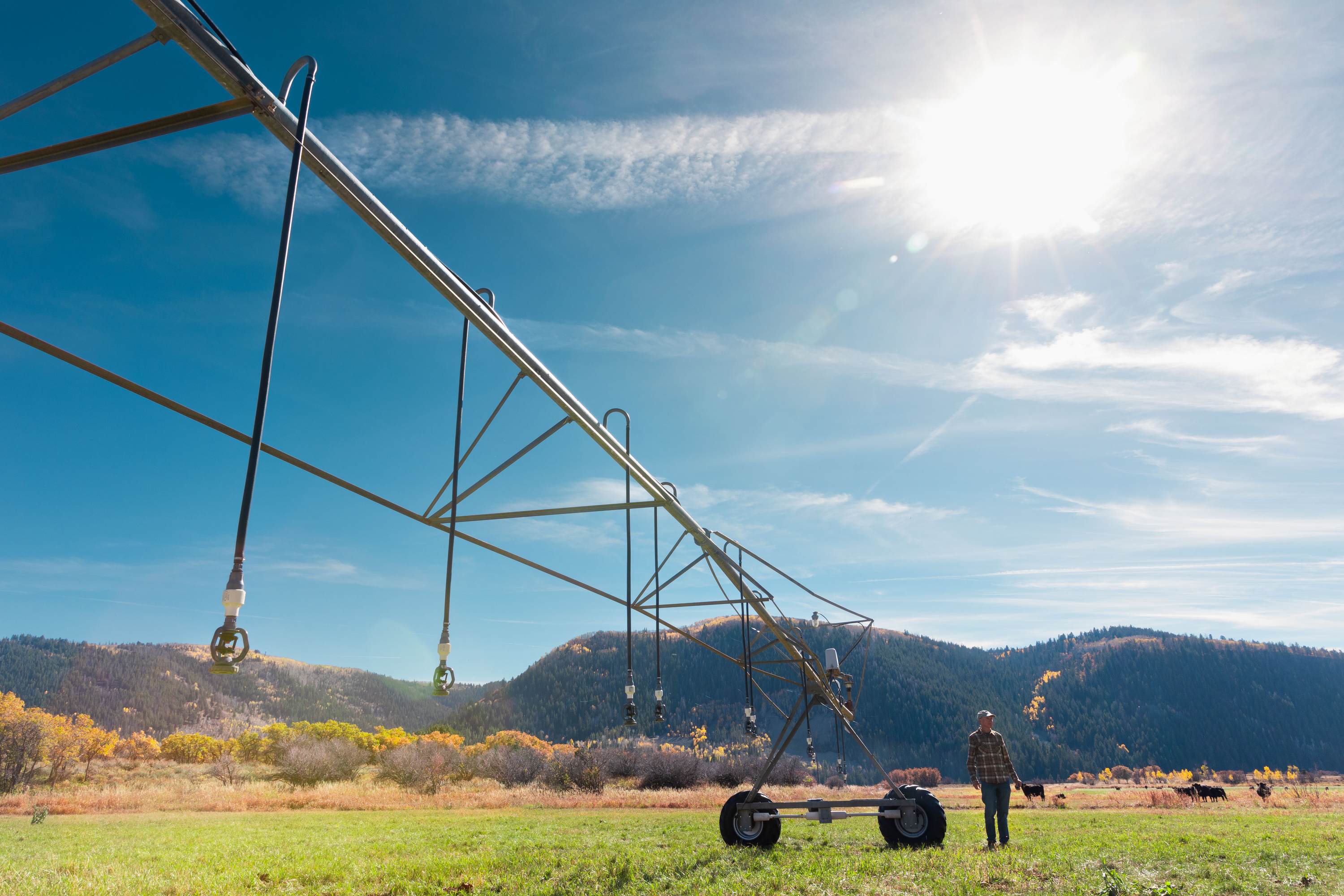Steve Clyde stands by a pivot irrigation system at his ranch in Kamas on Oct. 15.