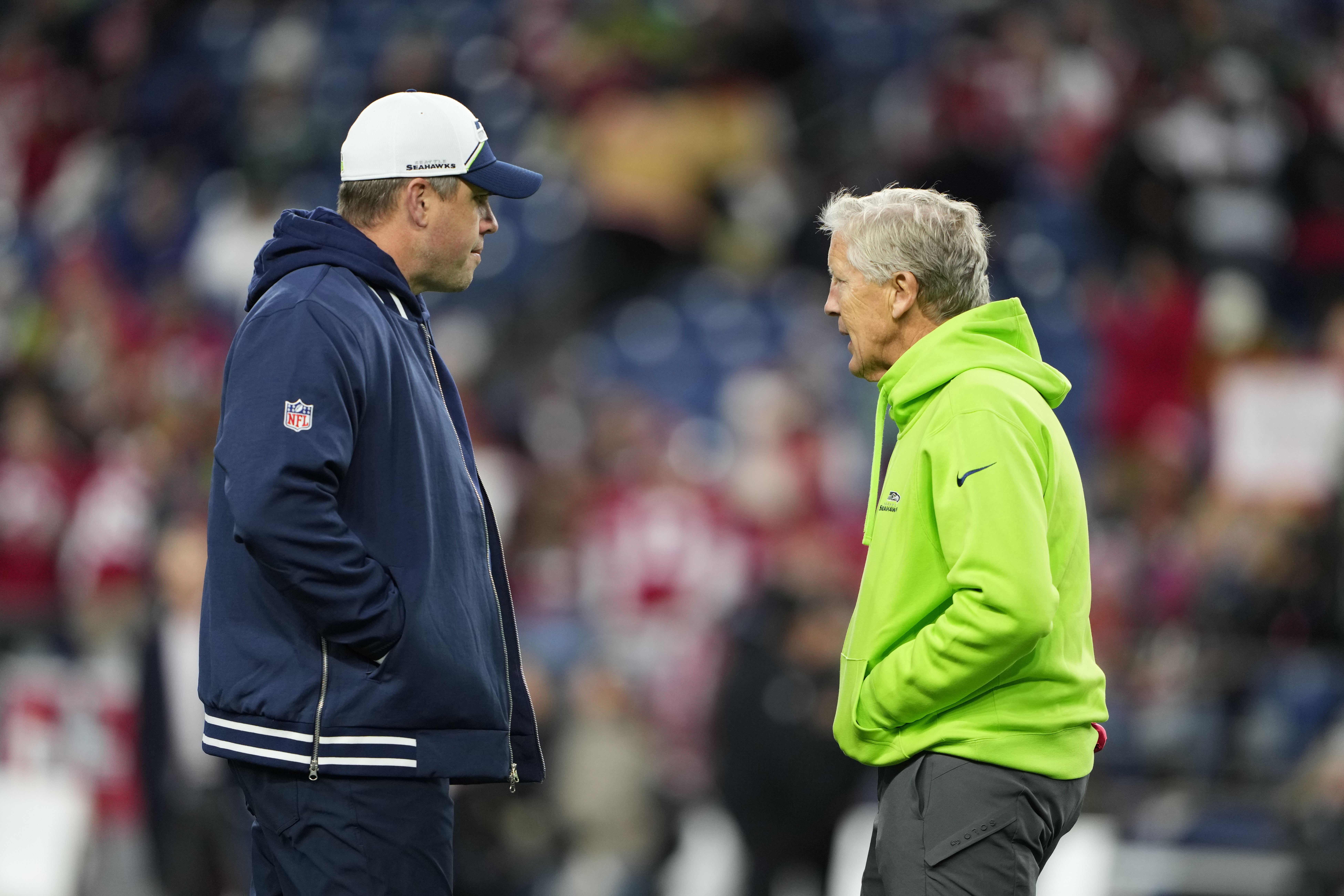 Seattle Seahawks offensive coordinator Shane Waldron, left, talks with head coach Pete Carroll before an NFL football game against the San Francisco 49ers, Thursday, Nov. 23, 2023, in Seattle. 