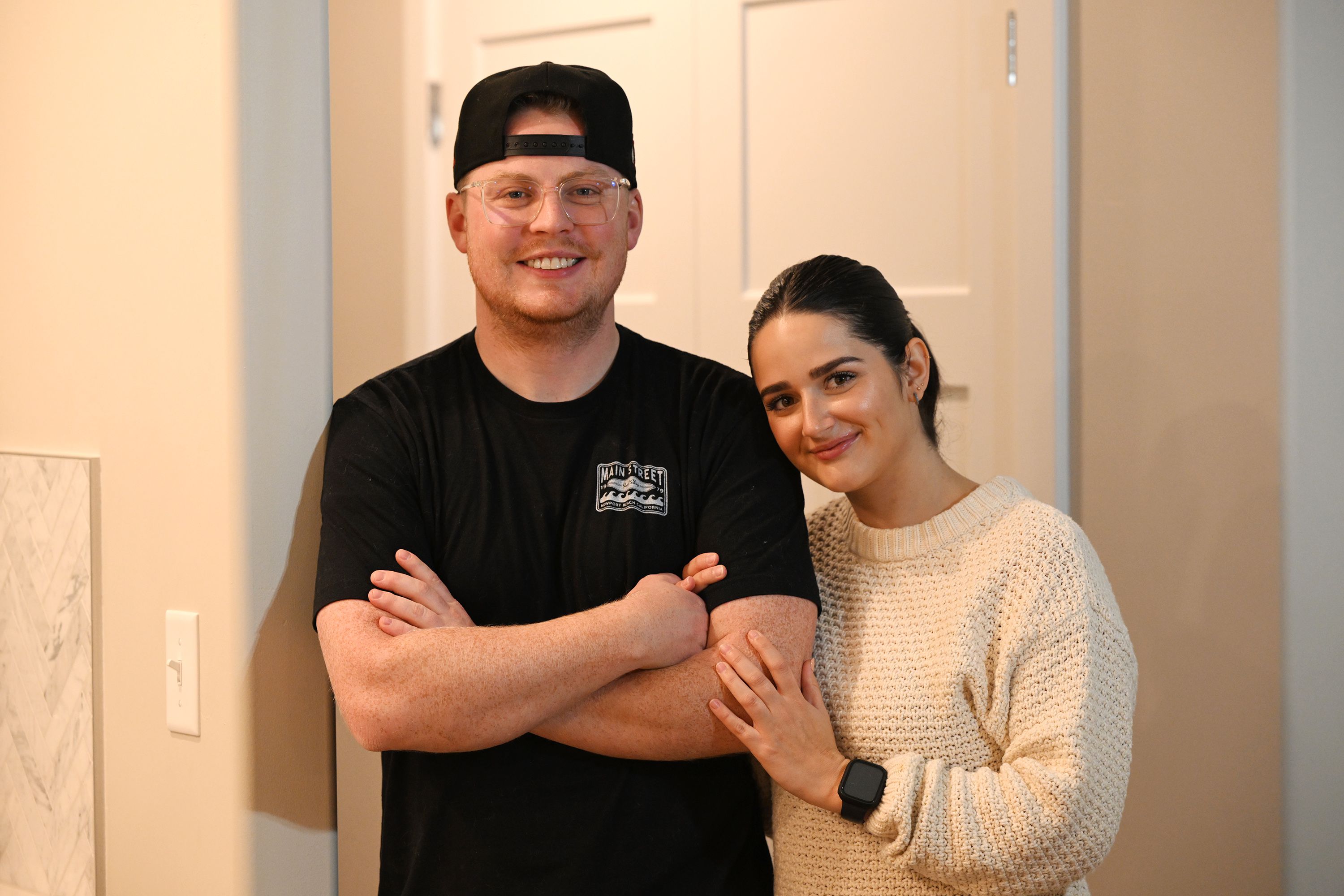 Zach and Kaitlyn Gordon pose for a photo in their new home in Spanish Fork on Tuesday.