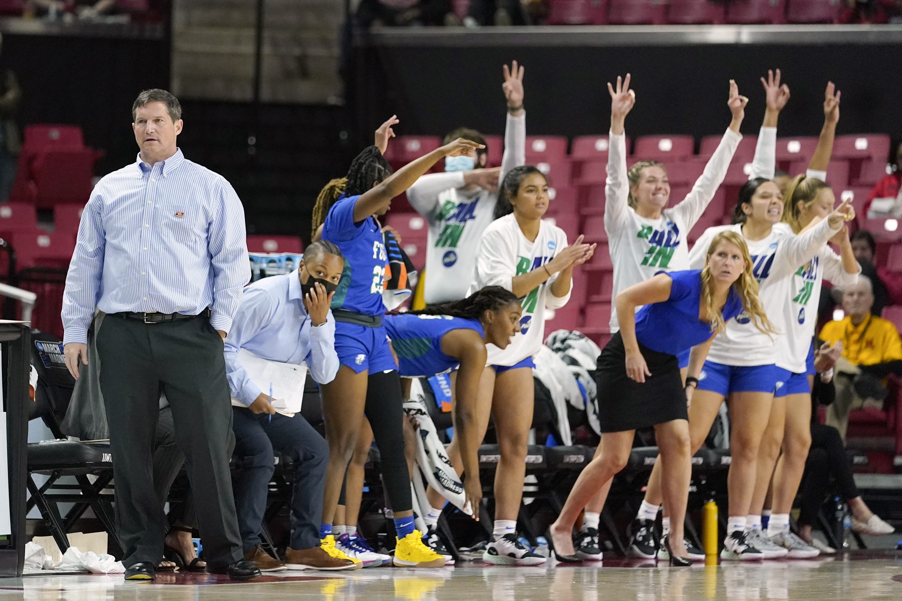 FILE - Florida Gulf Coast head coach Karl Smesko, left, looks on as his bench reacts to a three point shot by guard Kendall Spray during the first half of a college basketball game against Maryland in the second round of the NCAA tournament, March 20, 2022, in College Park, Md. Smesko has a team this season where every player is on the roster at the position of shooter, doing away with the traditional breakdown of guards, forwards and centers.