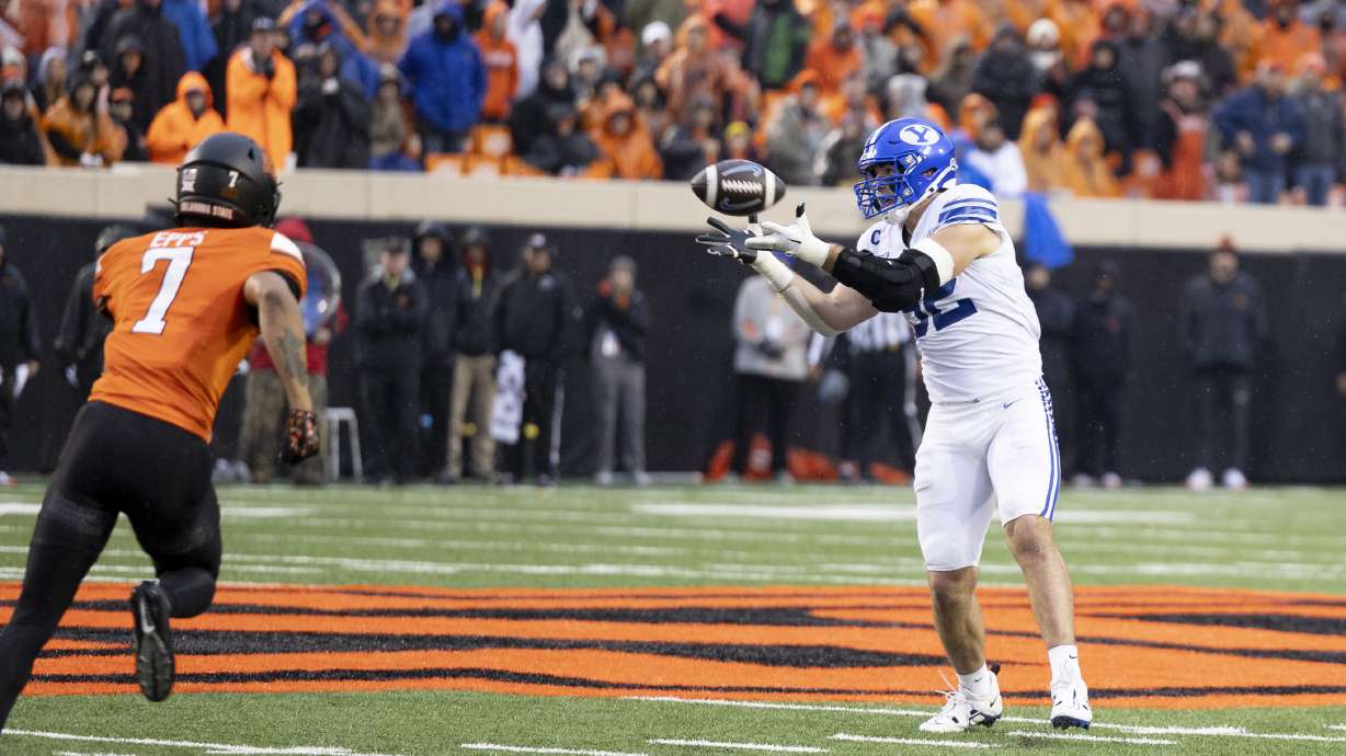 BYU defensive end Tyler Batty (92) catches the ball during a fake punt in the first half of an NCAA college football game against Oklahoma State Saturday, Nov. 25, 2023, in Stillwater, Okla.