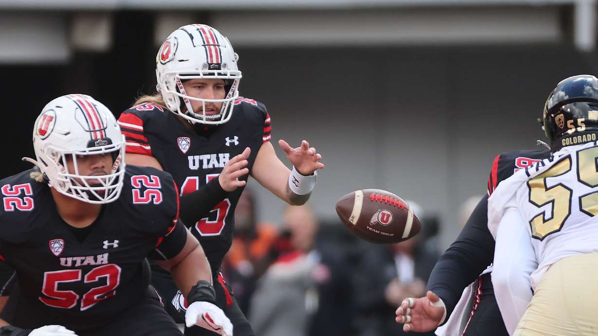 Utah Utes quarterback Luke Bottari (15) takes a snap in Salt Lake City on Saturday, Nov. 25, 2023. Utah won 23-17.