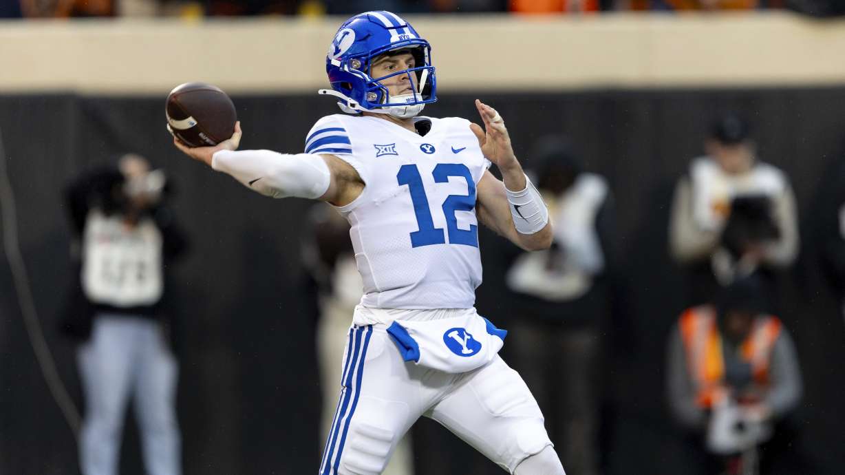 BYU quarterback Jake Retzlaff (12) passes the ball in the first half of an NCAA college football game against Oklahoma State Saturday, Nov. 25, 2023, in Stillwater, Okla.