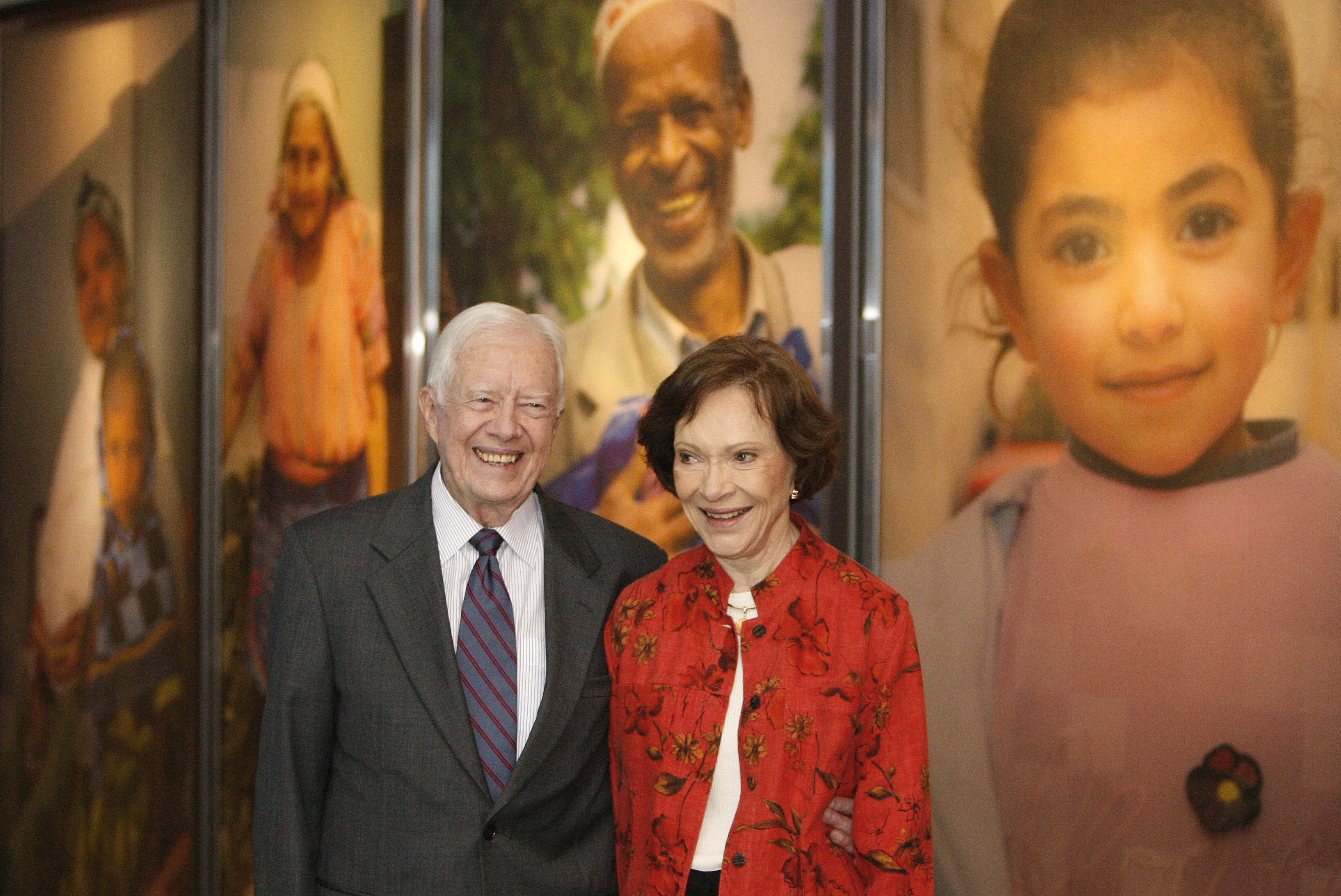 Former President Jimmy Carter and his wife Rosalynn look at a new interactive exhibit at the Jimmy Carter Library and Museum in Atlanta on Sept. 28, 2009.