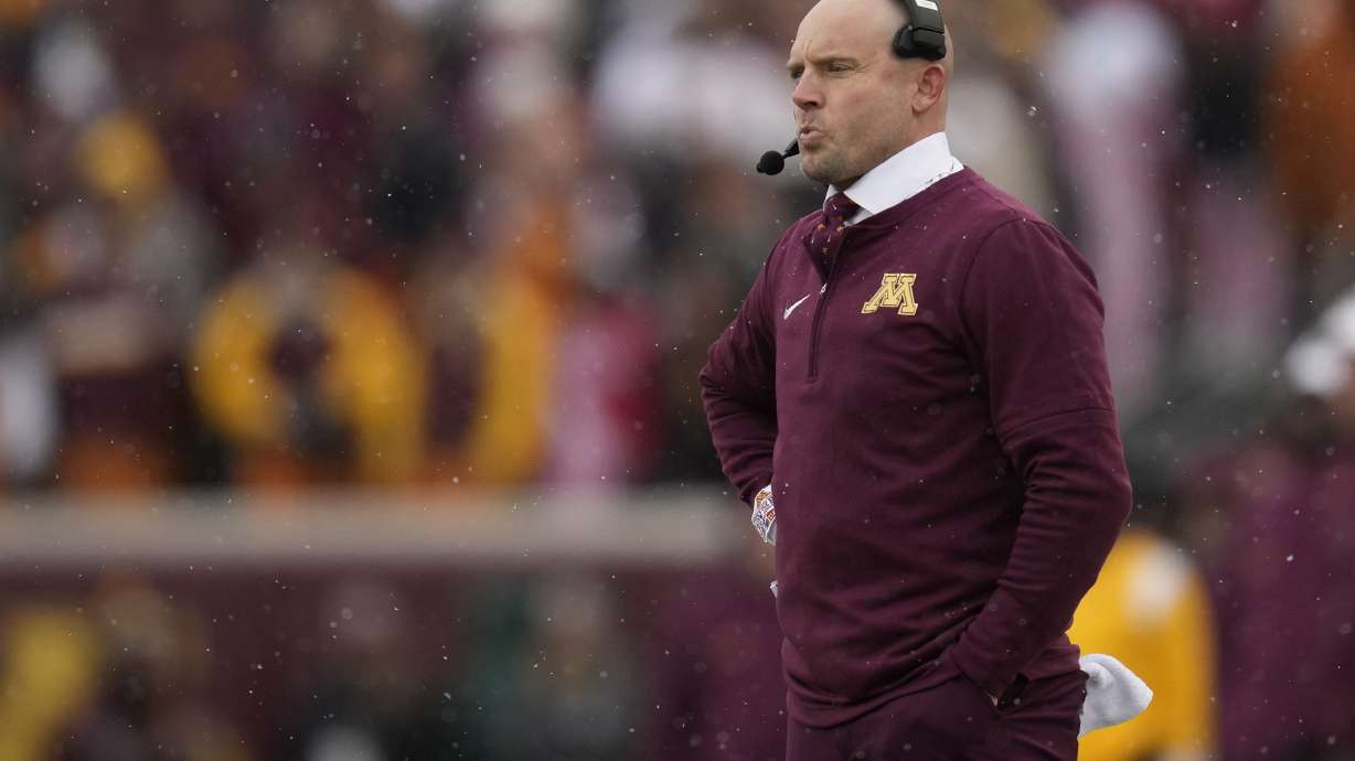 Minnesota head coach P. J. Fleck stands on the sideline during the first half of an NCAA college football game against Wisconsin, Saturday, Nov. 25, 2023, in Minneapolis.