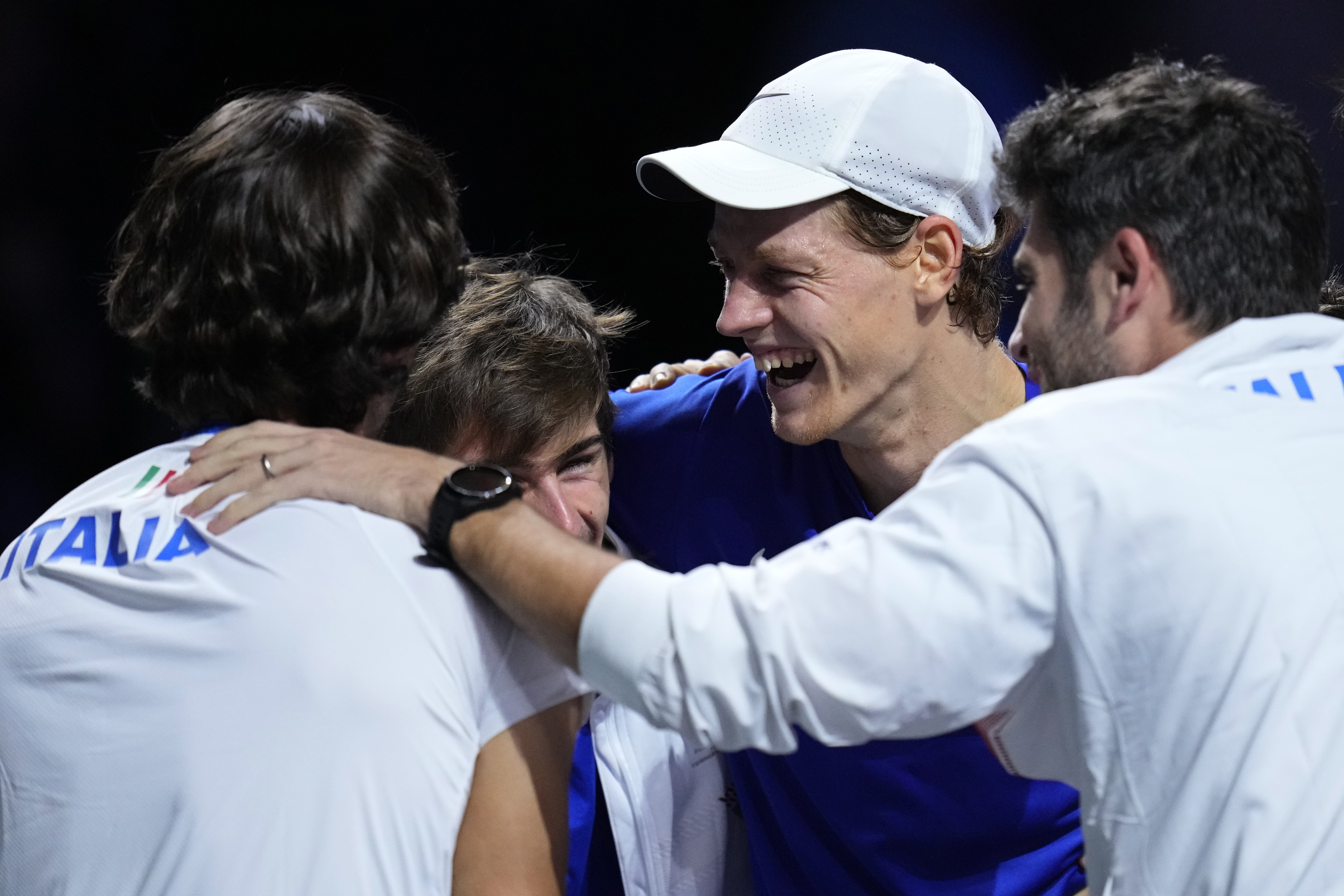 Jannik Sinner of Italy, 3rd left, celebrates with team members after defeating Alex de Minaur of Australia in Match 2 during a Davis Cup final tennis match between Australia and Italy in Malaga, Spain, Sunday, Nov. 26, 2023. Italy are David Cup winners.