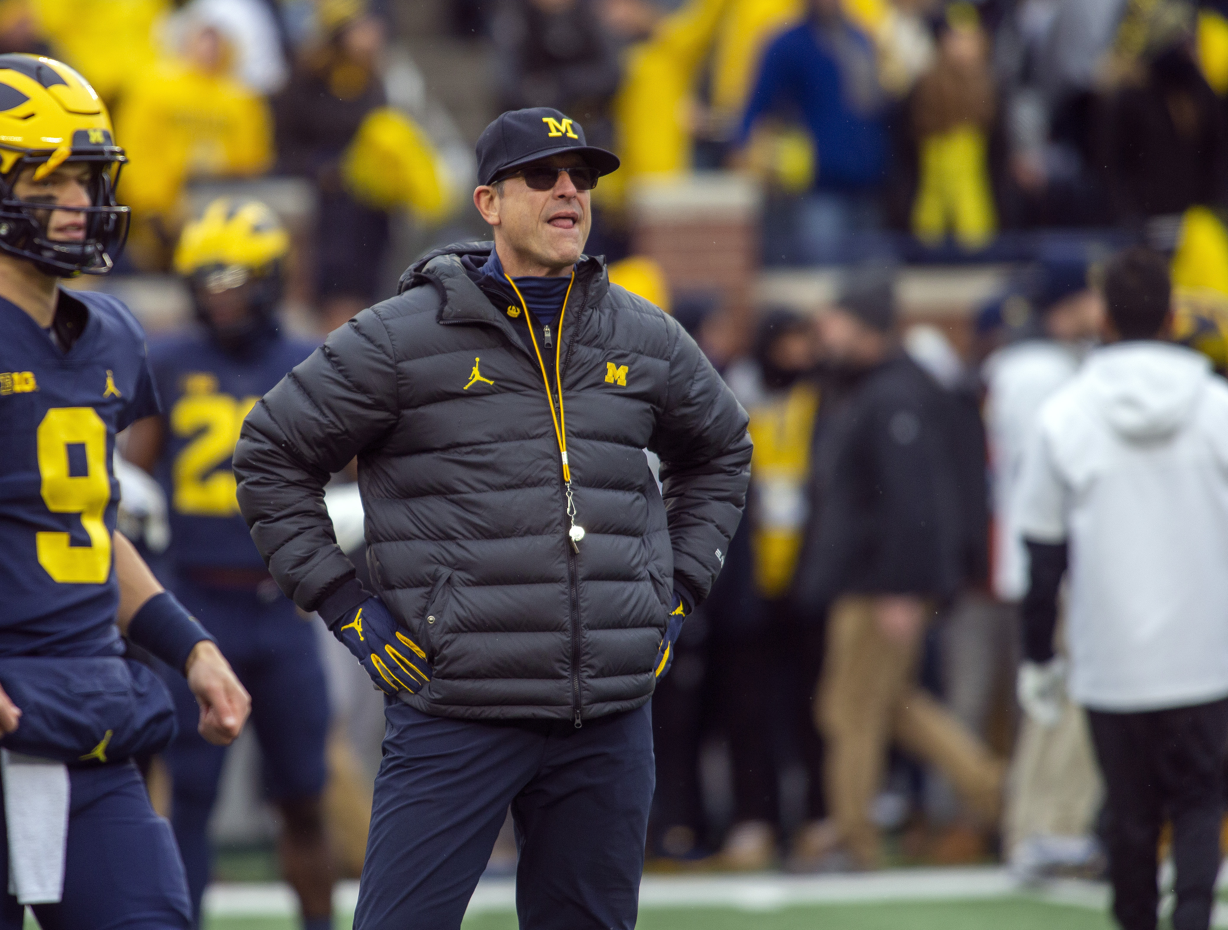 FILE - Michigan head coach Jim Harbaugh watches warmups before an NCAA college football game against Ohio State in Ann Arbor, Mich., Saturday, Nov. 27, 2021. Michigan won 42-27. 