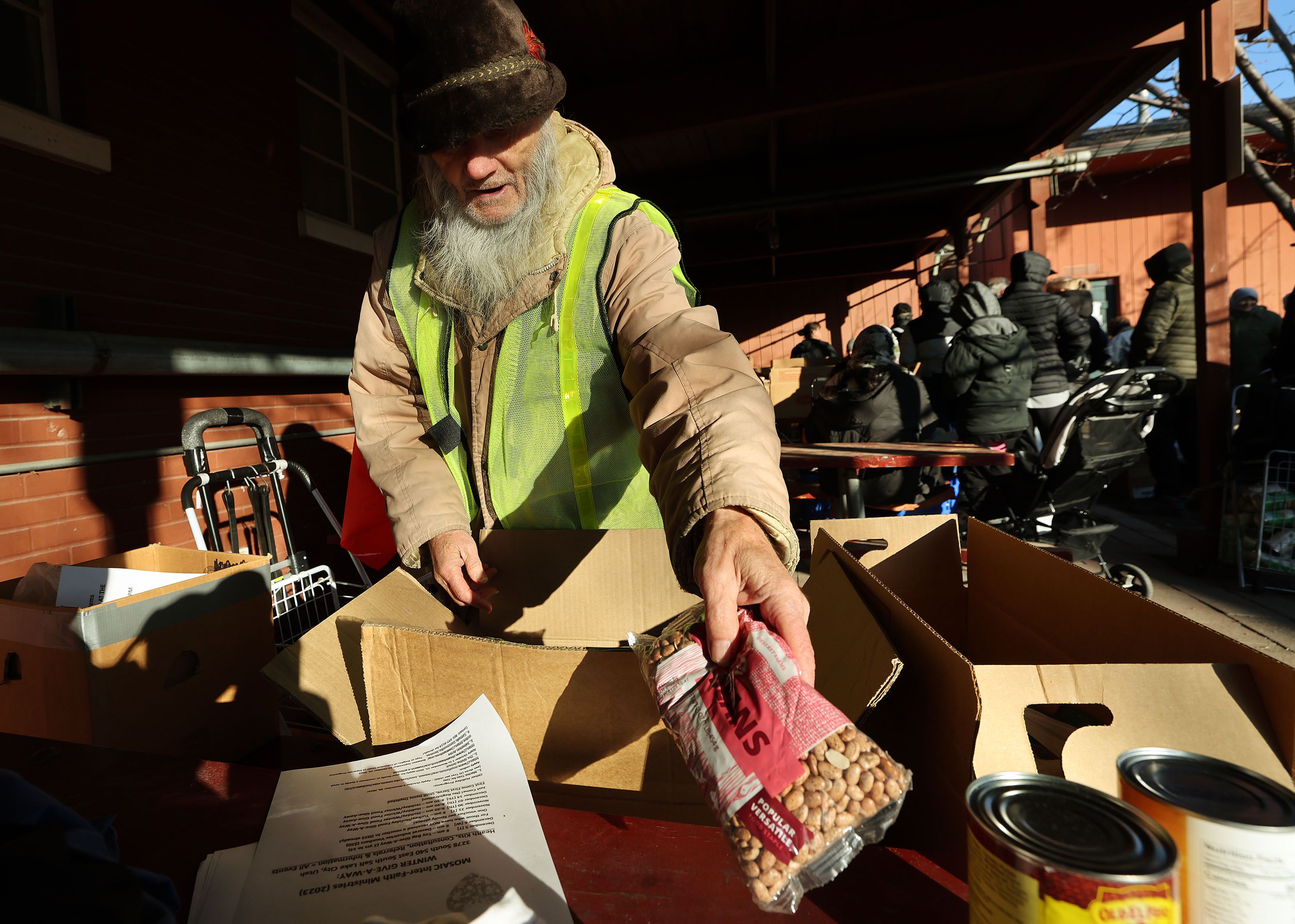 Hal (no last name to be used) receives food as Mosaic Inter-Faith Ministries hands out Thanksgiving meals in Salt Lake City on Nov. 21.