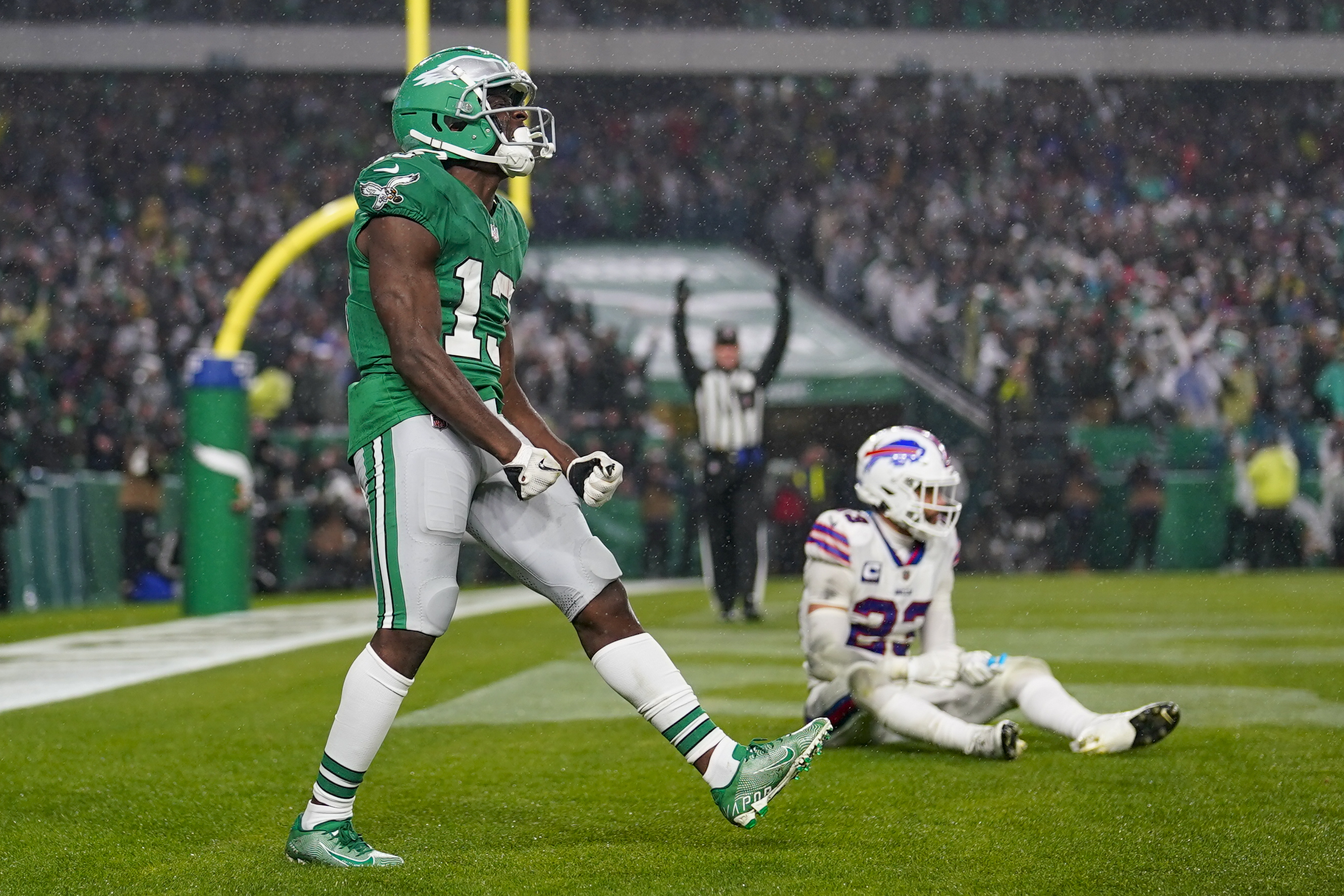 Philadelphia Eagles wide receiver Olamide Zaccheaus celebrates after catching a touchdown pass over Buffalo Bills safety Micah Hyde during the second half of an NFL football game Sunday, Nov. 26, 2023, in Philadelphia. 