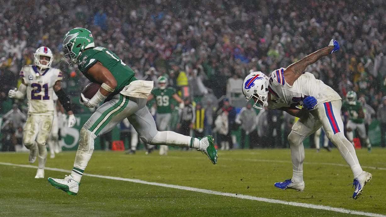 Philadelphia Eagles quarterback Jalen Hurts scores the game winning touchdown against the Buffalo Bills during overtime in an NFL football game Sunday, Nov. 26, 2023, in Philadelphia.
