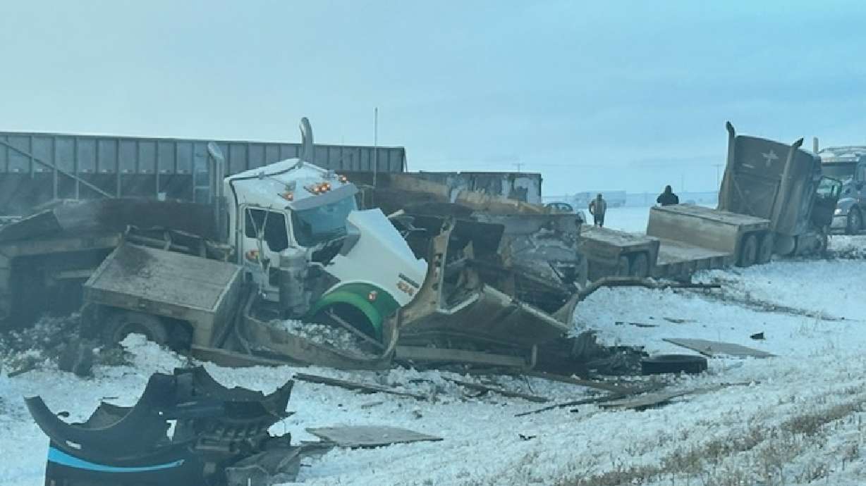 Emergency crews respond to a large crash involving multiple vehicles and semi-trucks on I-86 in Pocatello, Idaho, on Monday. One man has died after being injured in that crash.