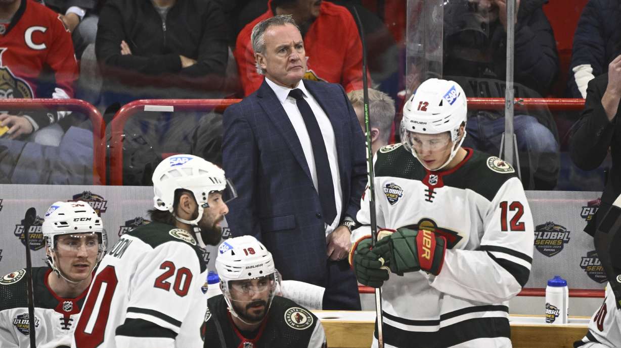 Minnesotas head coach Dean Evason, rear center, attends the NHL Global Series Sweden ice hockey match between Minnesota Wild and Ottawa Senators at Avicii Arena in Stockholm, Sweden, Saturday, Nov. 18, 2023.